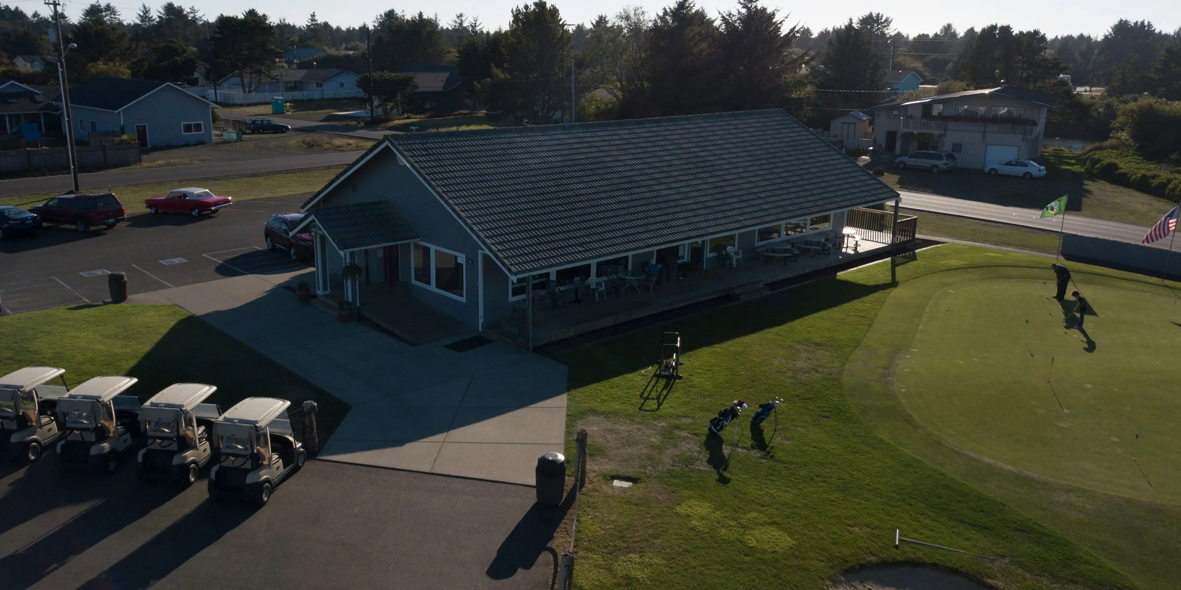 Landscape putting greens and fairway photo of the Ocean Shores Golf Course golf course