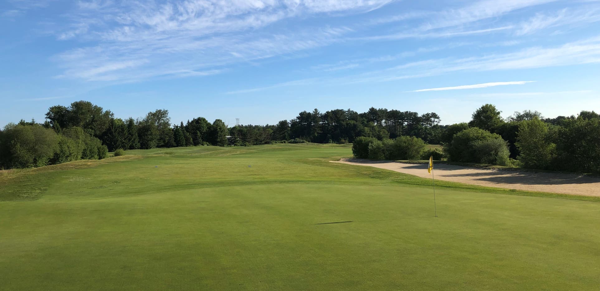 Landscape putting greens and fairway photo of the Olde Scotland Links golf course