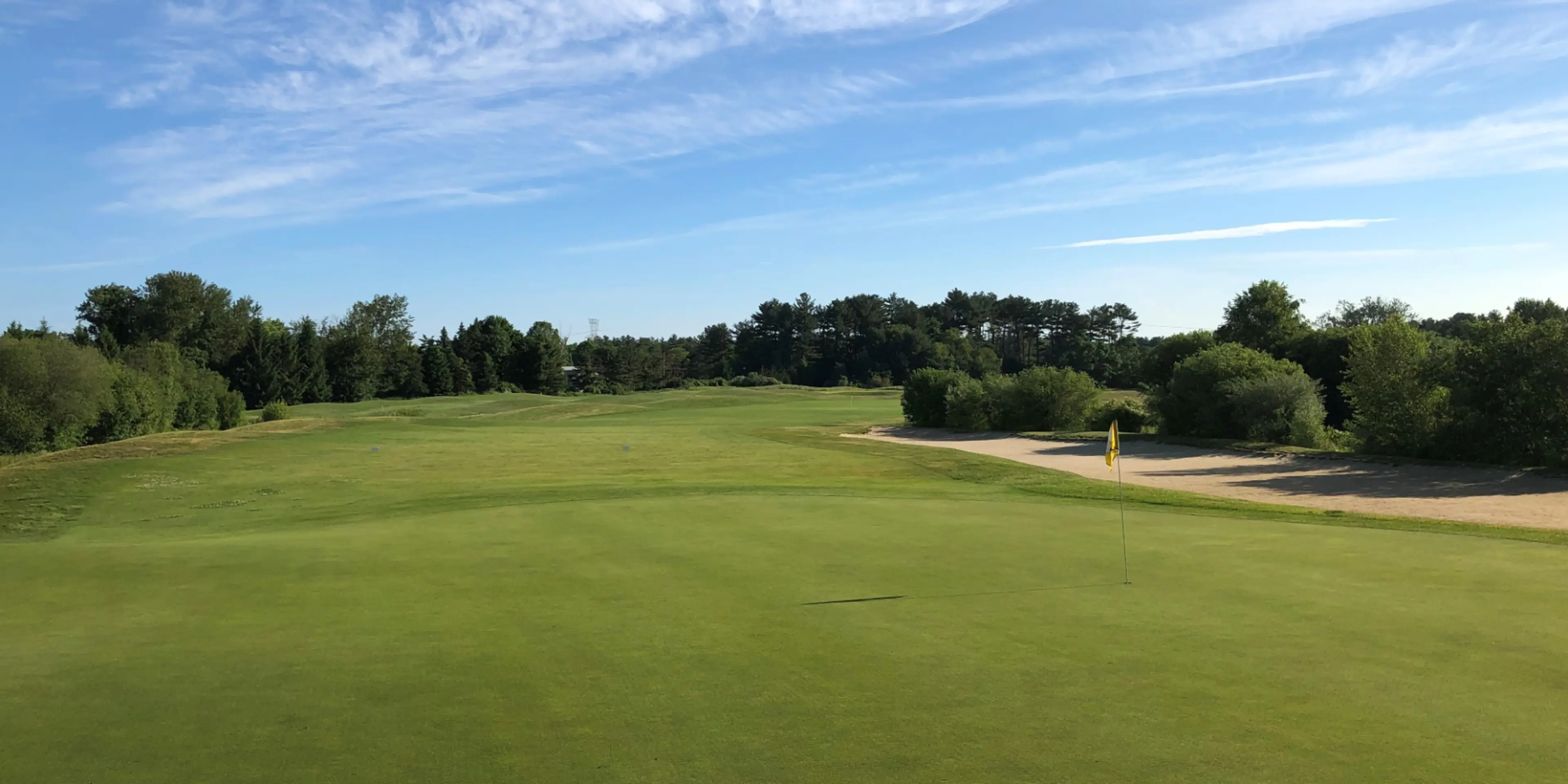 Landscape putting greens and fairway photo of the Olde Scotland Links golf course