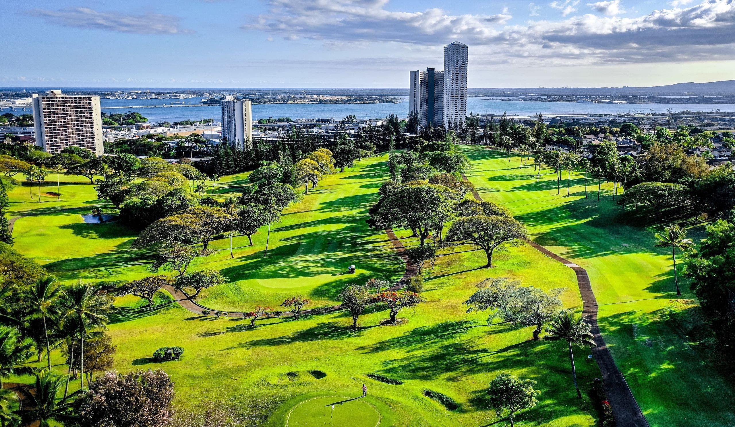 Landscape putting greens and fairway photo of the Pearl at Kalauao golf course