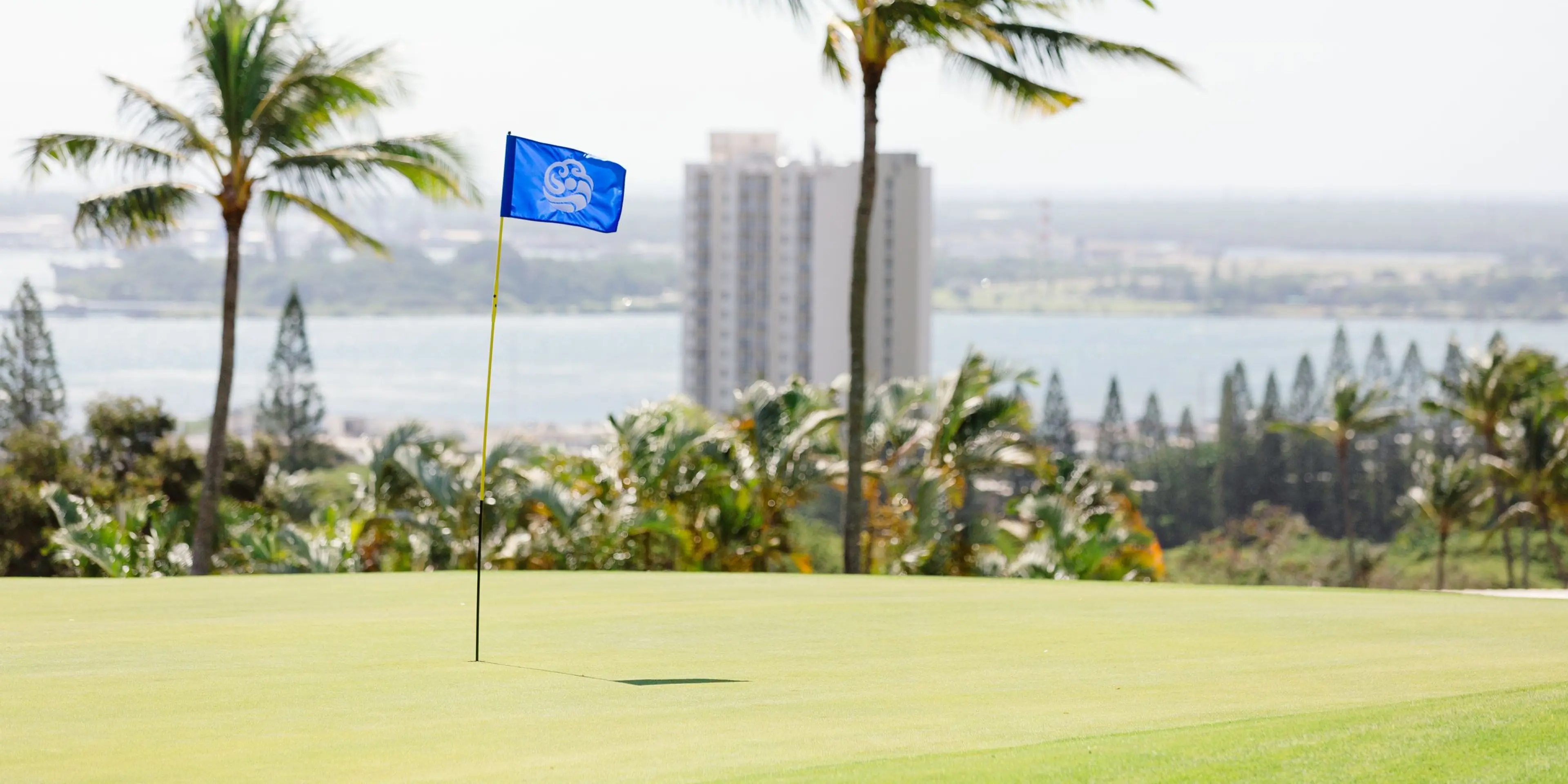 Landscape putting greens and fairway photo of the Pearl at Kalauao golf course