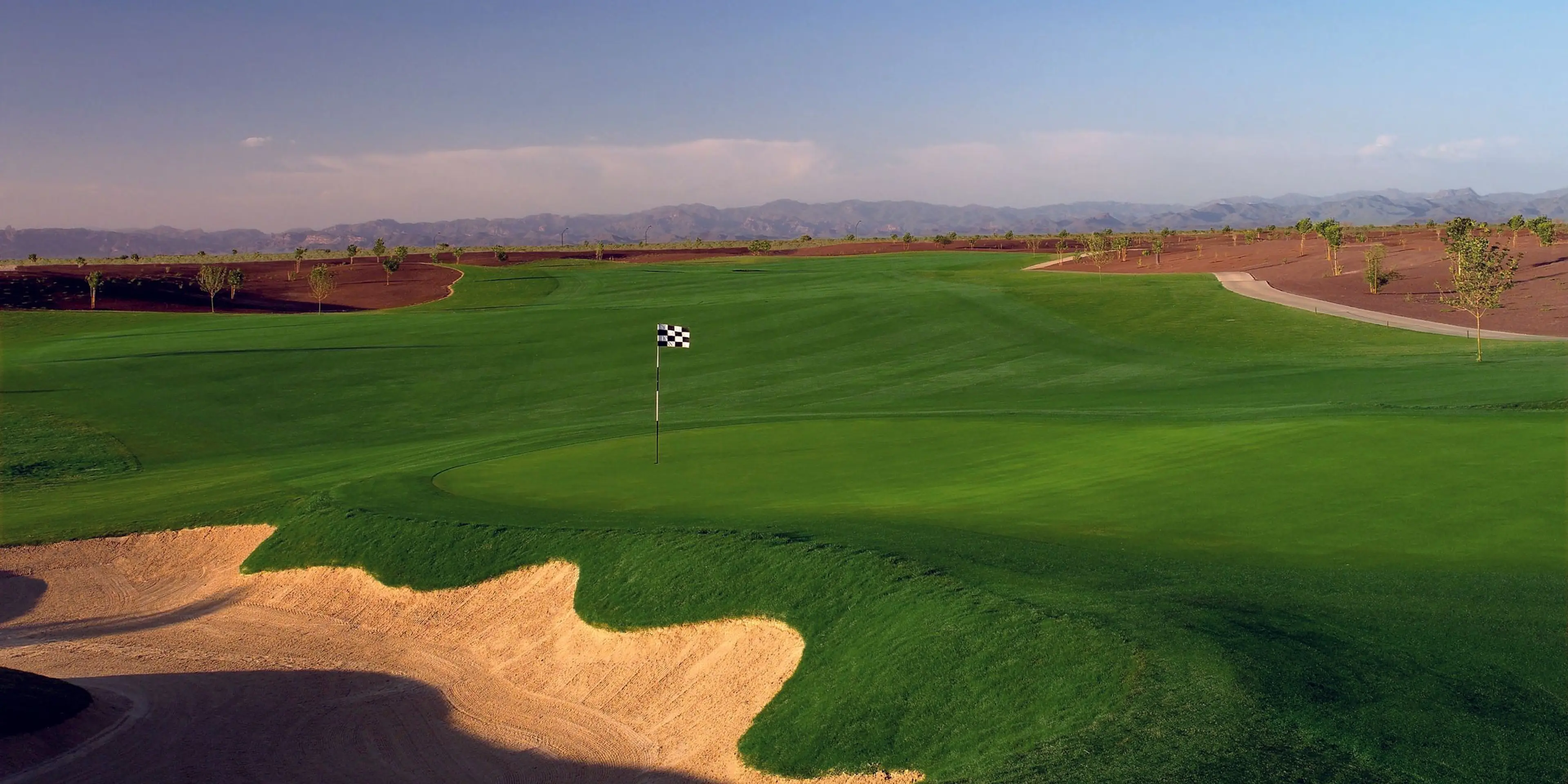 Landscape putting greens and fairway photo of the Poston Butte Golf Club golf course