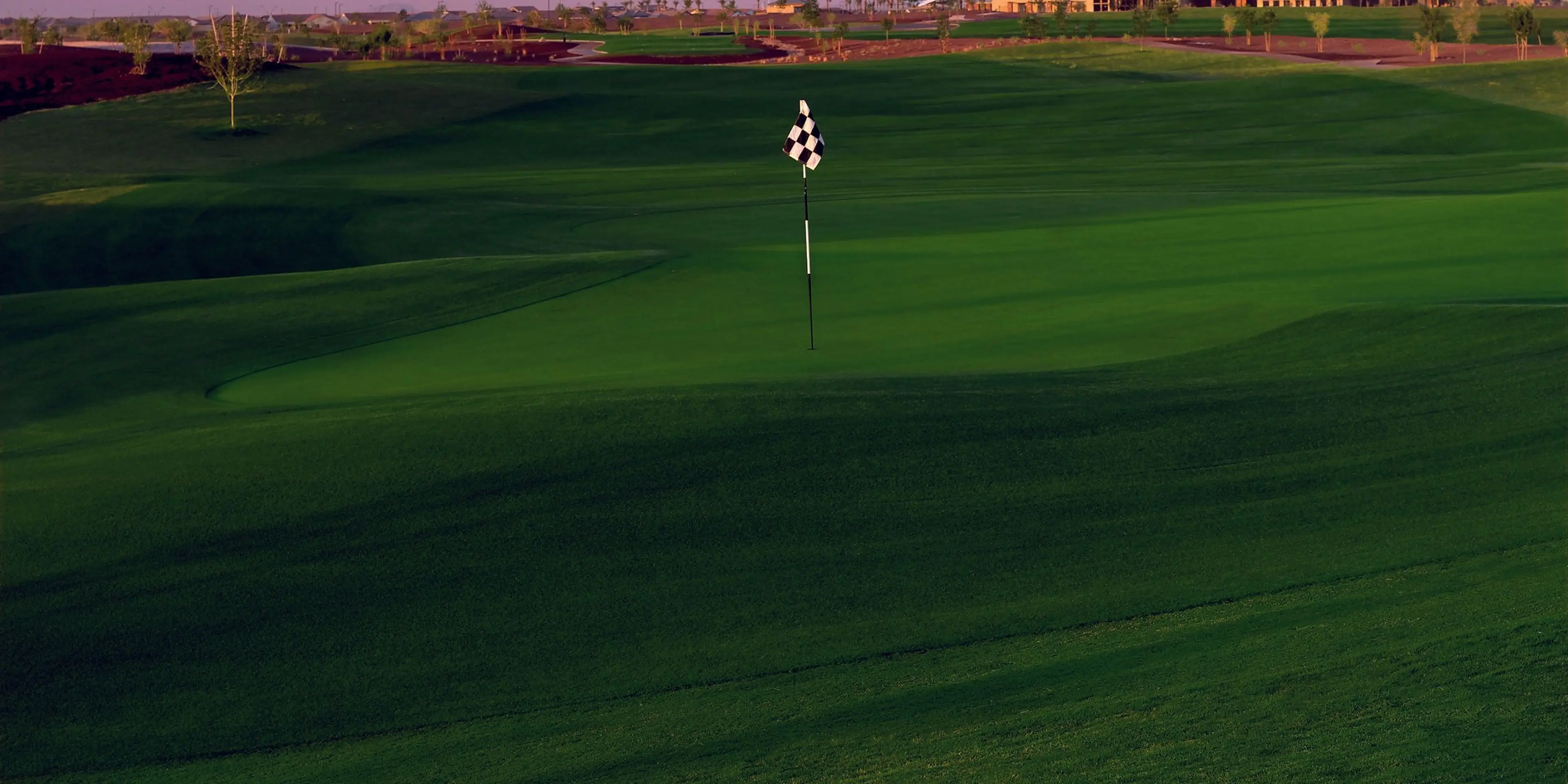 Landscape putting greens and fairway photo of the Poston Butte Golf Club golf course