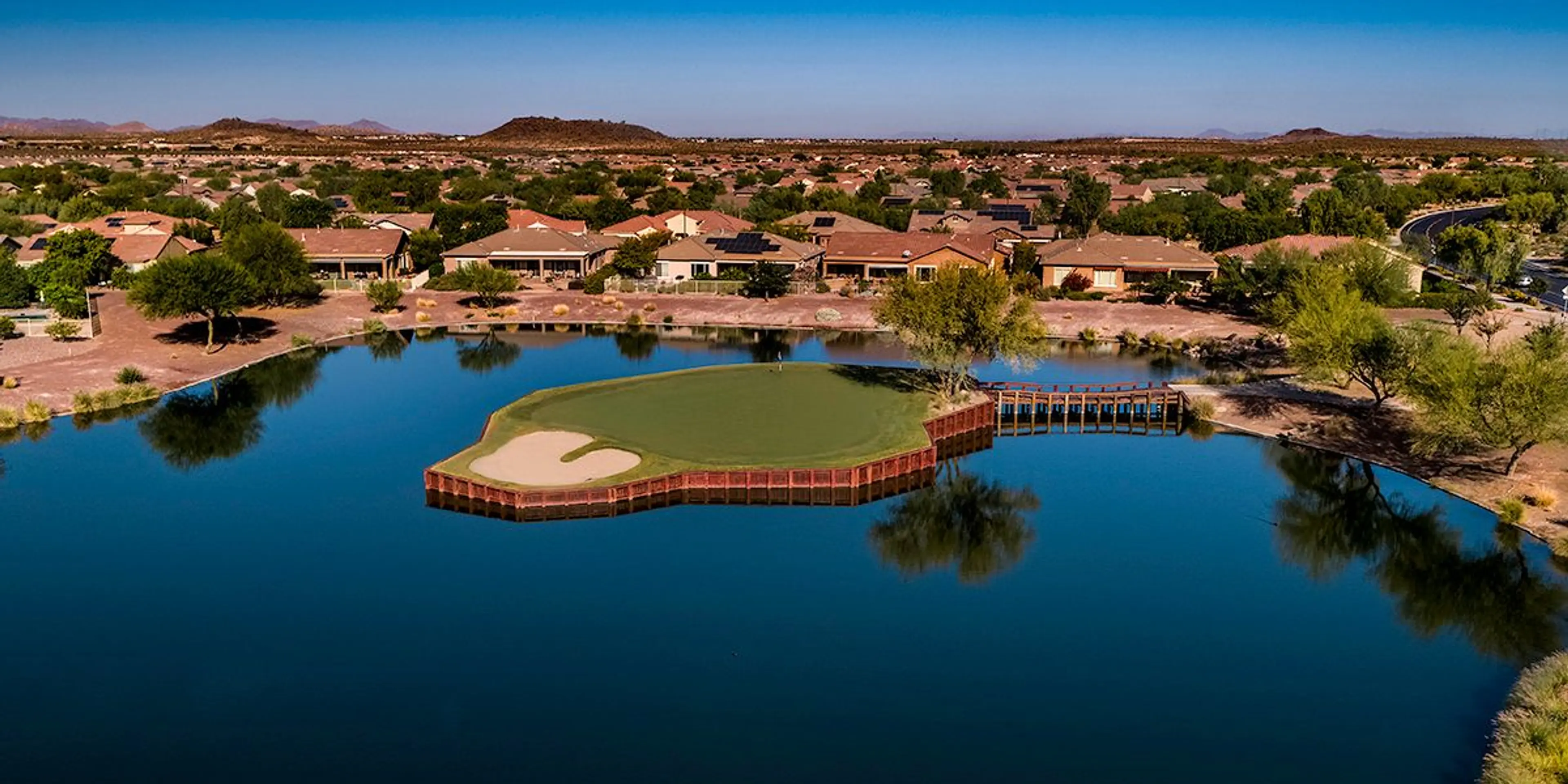 Landscape putting greens and fairway photo of the Poston Butte Golf Club golf course