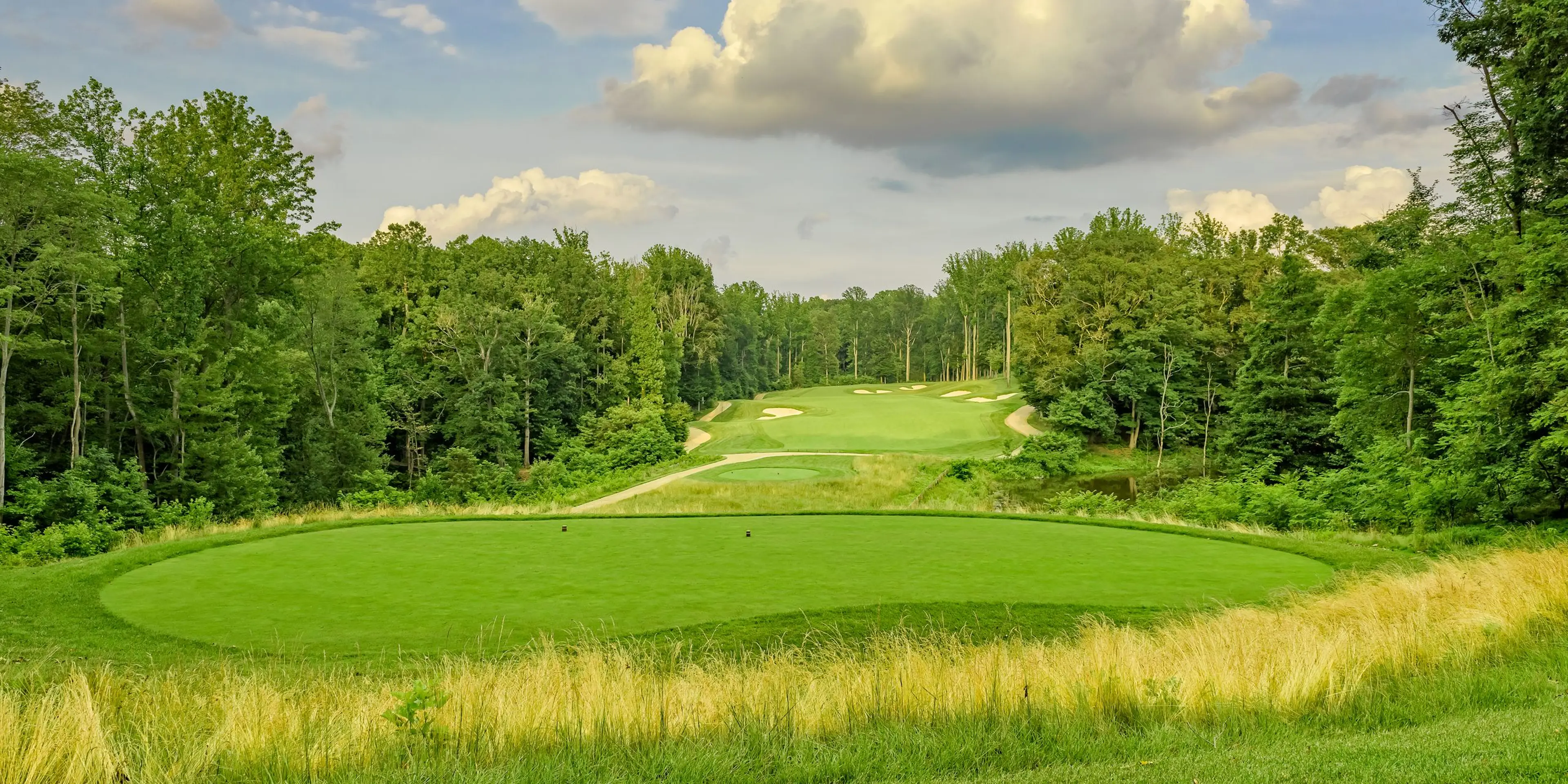 Landscape putting greens and fairway photo of the Potomac Shores Golf Club golf course
