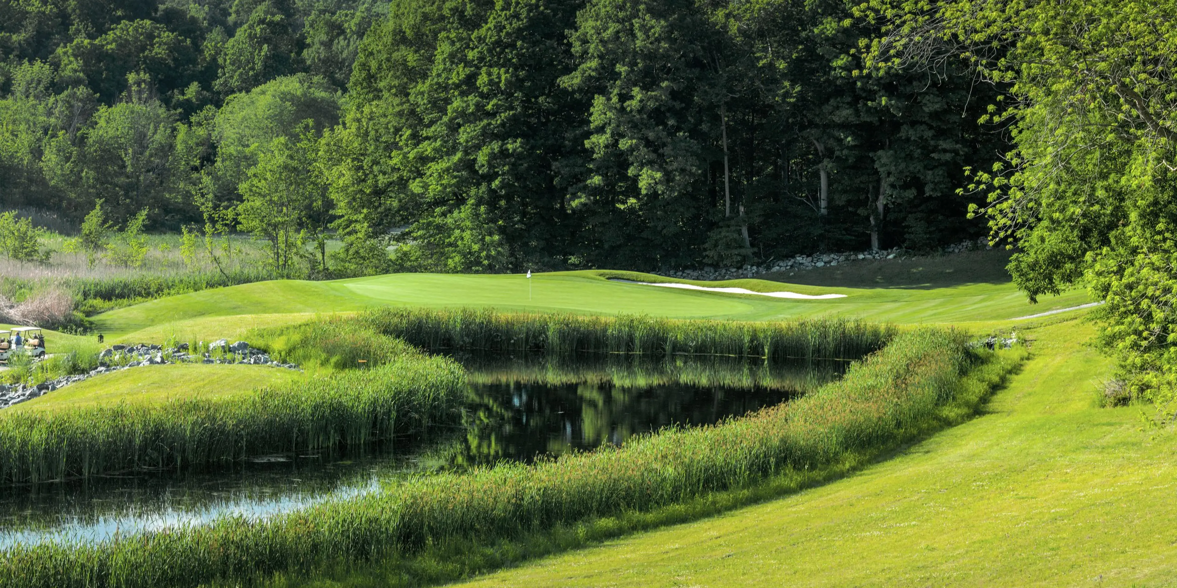 Landscape putting greens and fairway photo of the Putnam County Golf Course golf course