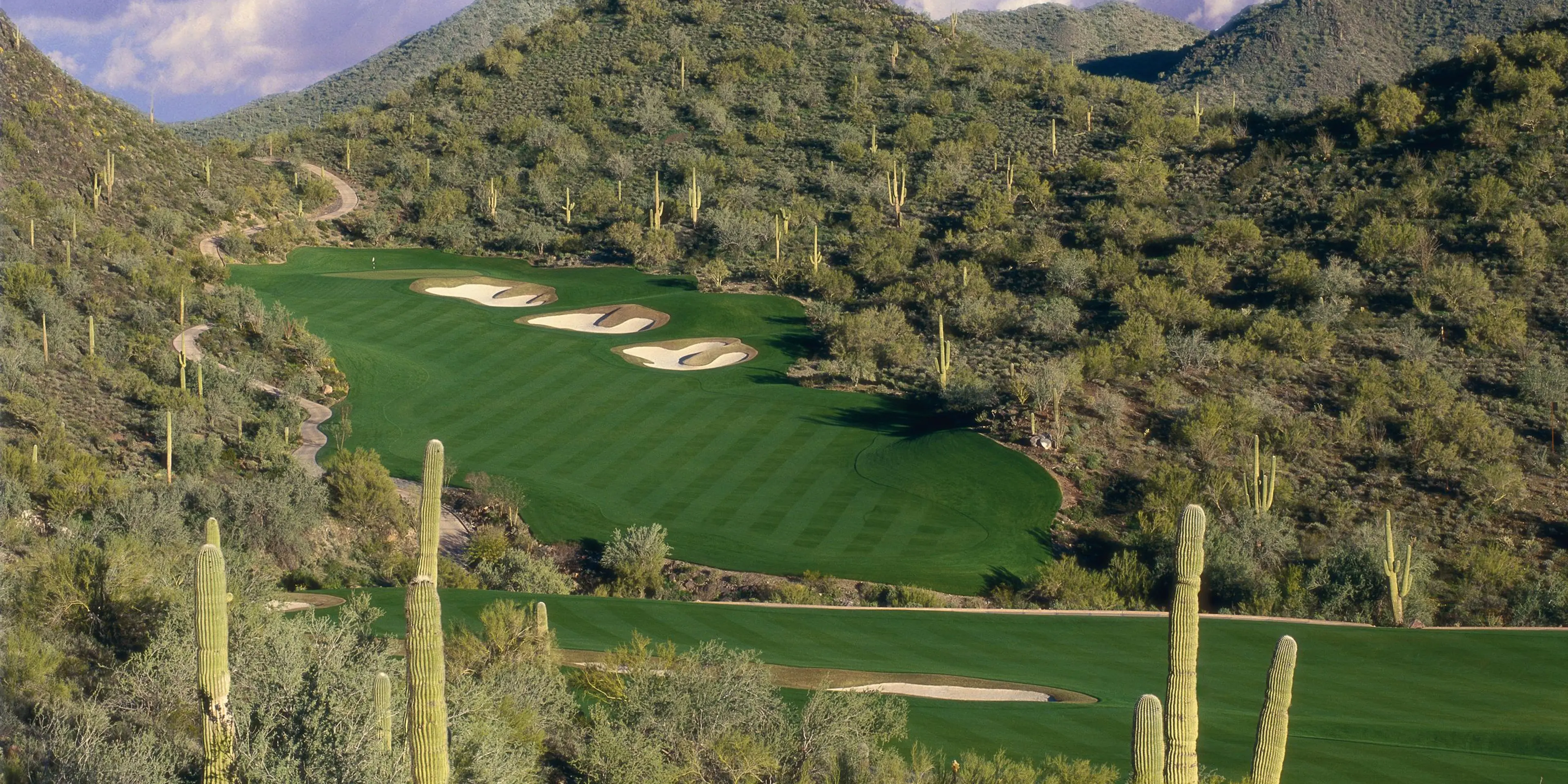 Landscape putting greens and fairway photo of the Quintero Golf Club golf course