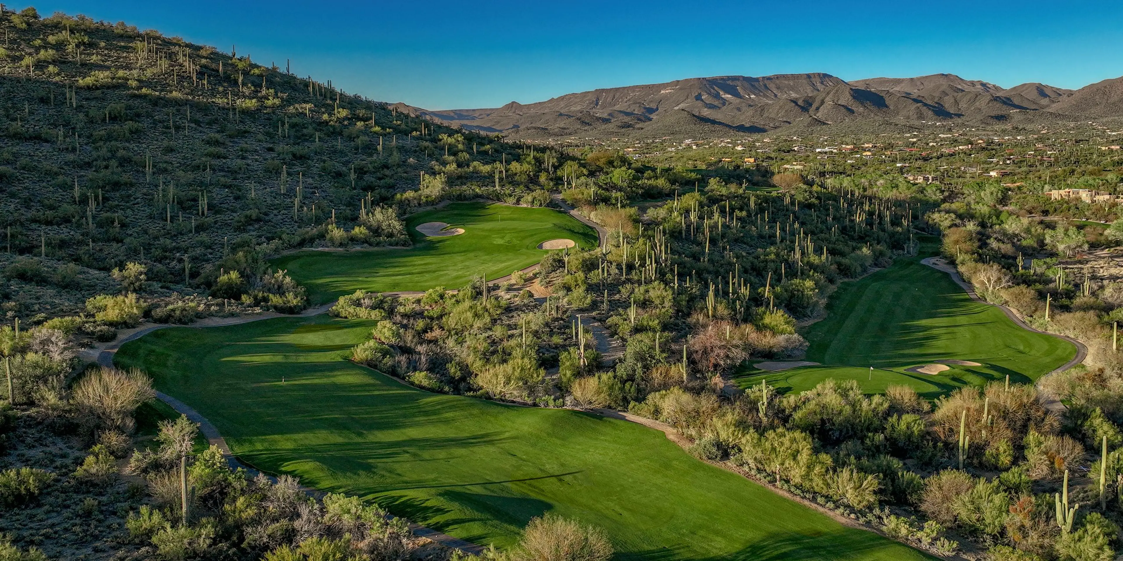 Landscape putting greens and fairway photo of the Rancho Mañana Golf Club golf course