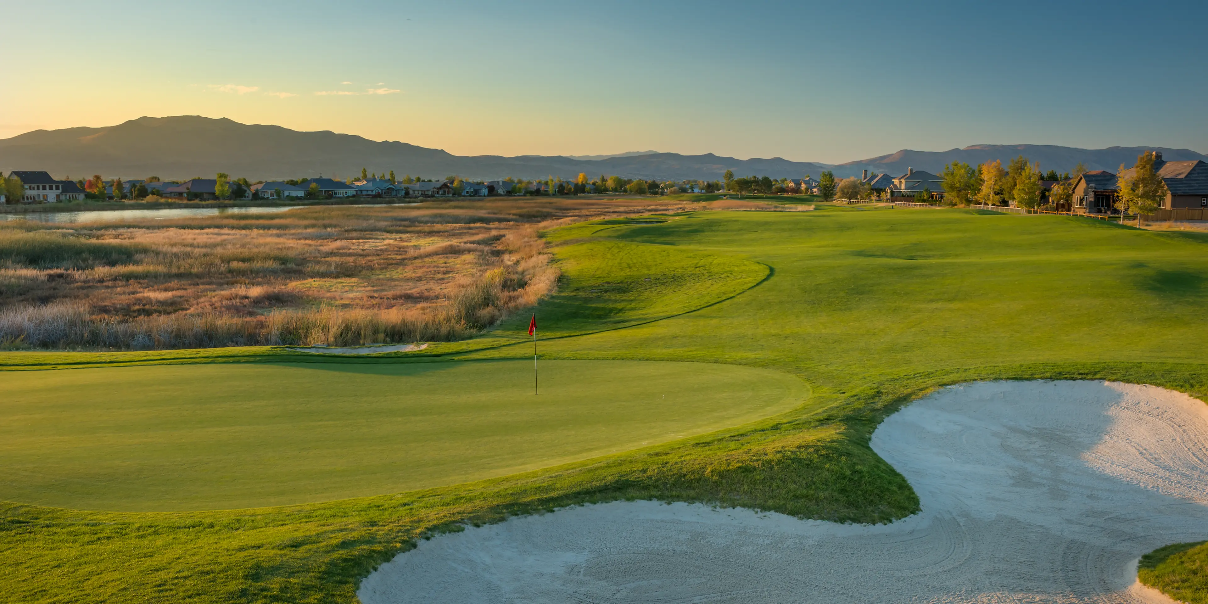 Landscape putting greens and fairway photo of the Red Hawk Golf and Resort golf course