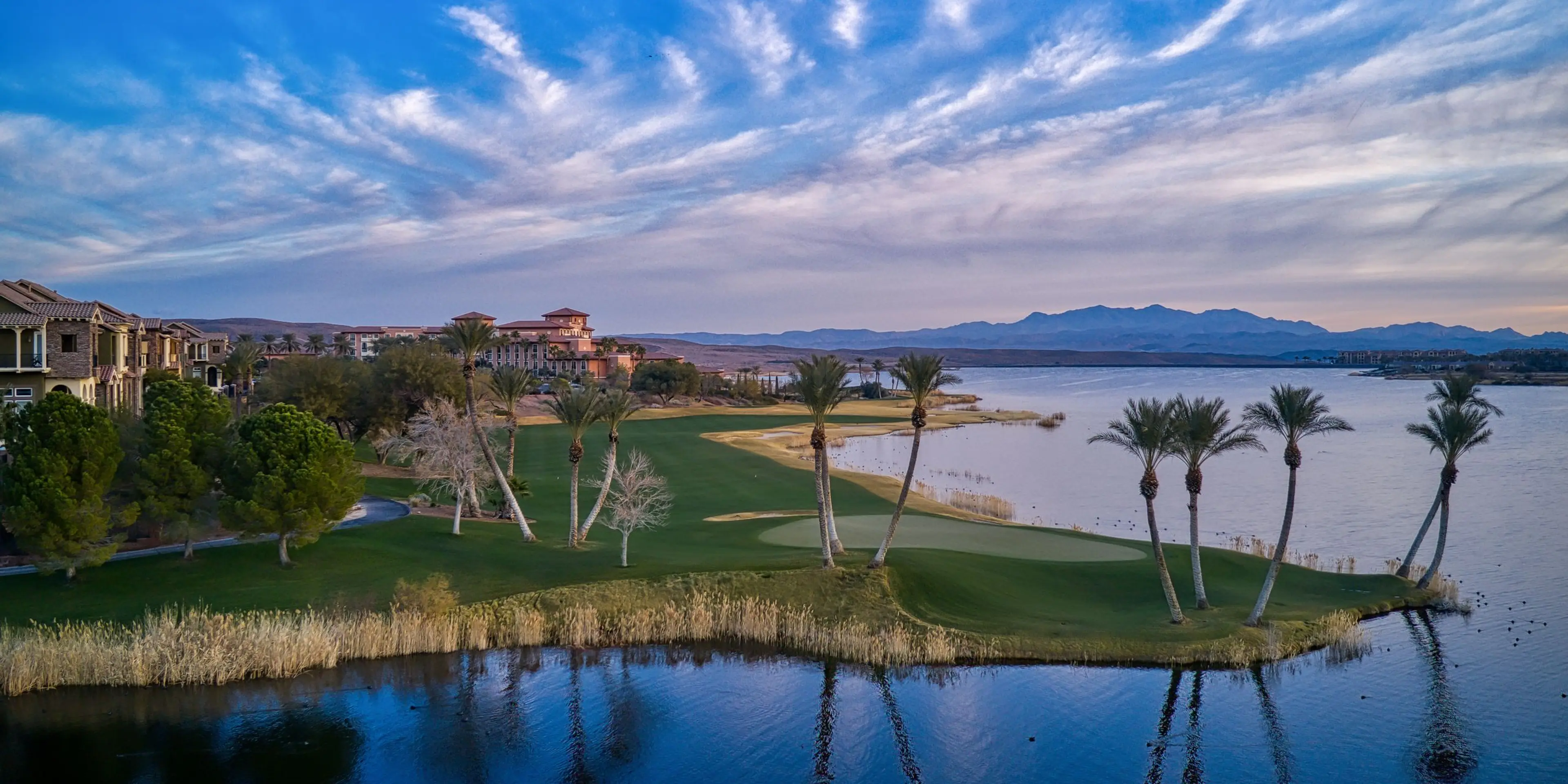 Landscape putting greens and fairway photo of the Reflection Bay Golf Club golf course