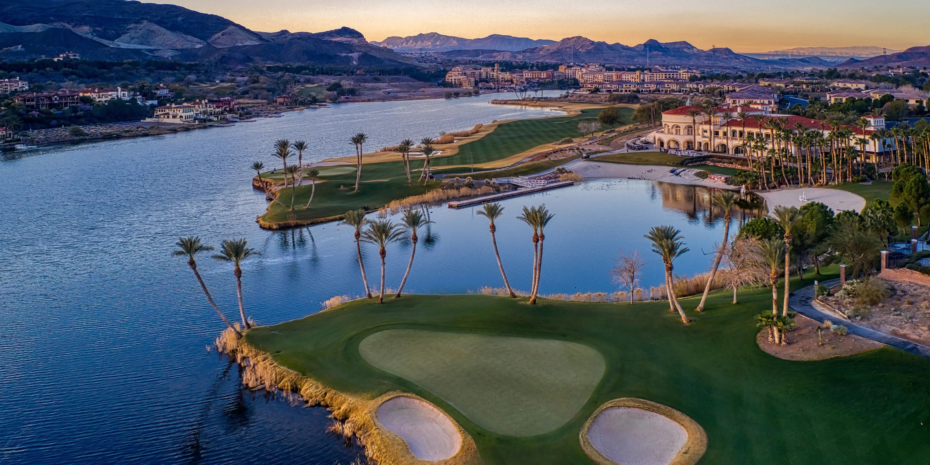 Landscape putting greens and fairway photo of the Reflection Bay Golf Club golf course