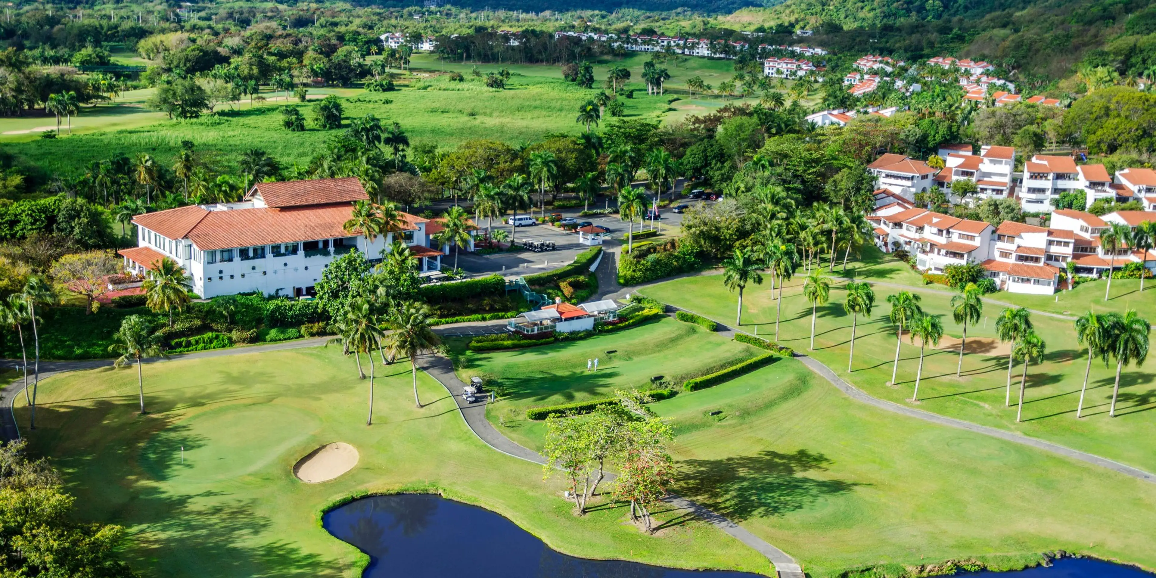 Landscape putting greens and fairway photo of the Rio Mar Country Club golf course