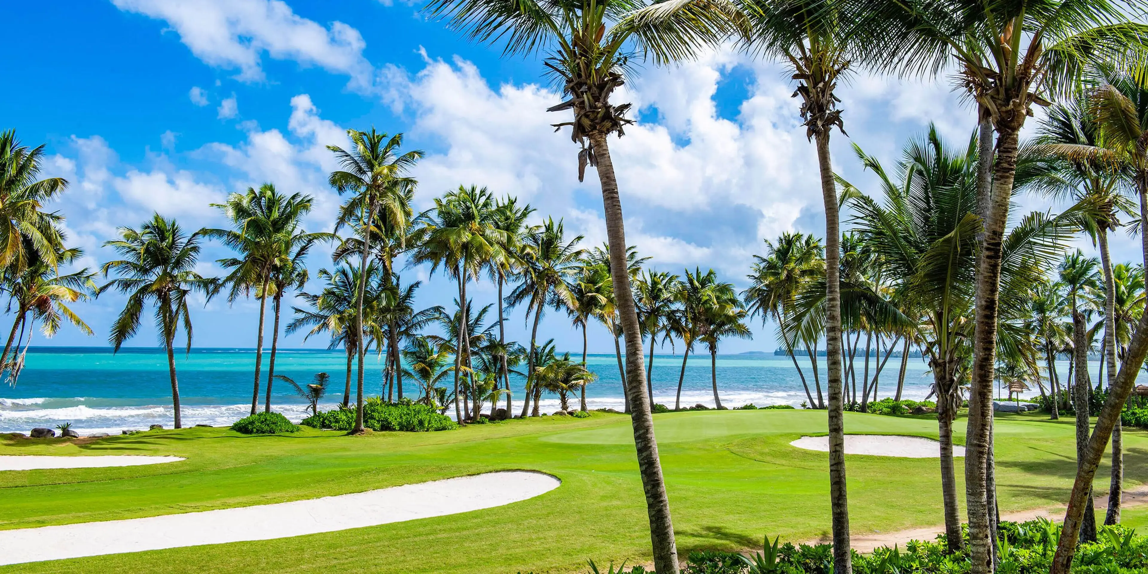 Landscape putting greens and fairway photo of the Rio Mar Country Club golf course