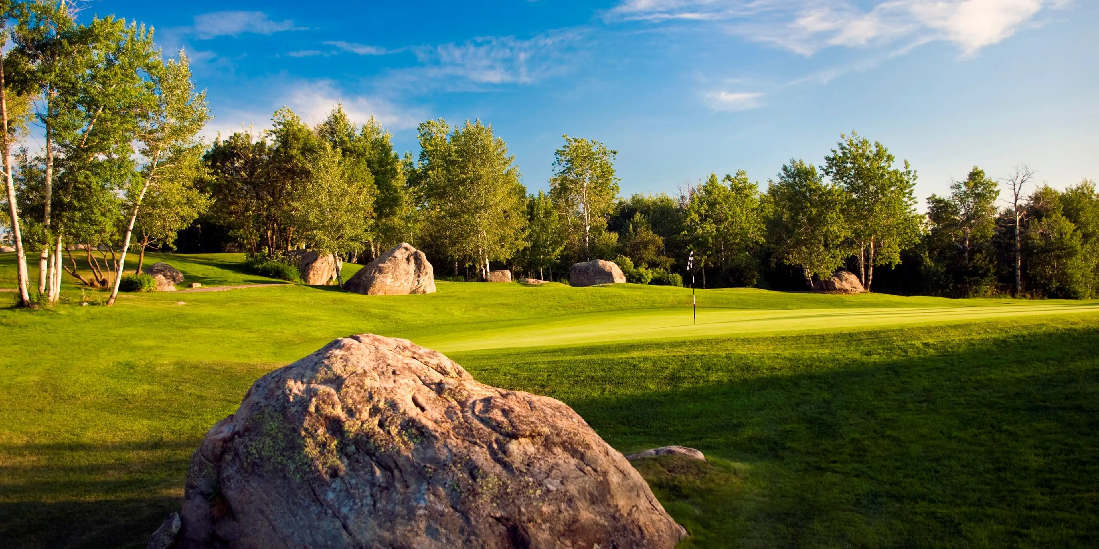 Landscape putting greens and fairway photo of the Rollingstone Ranch Golf Club golf course