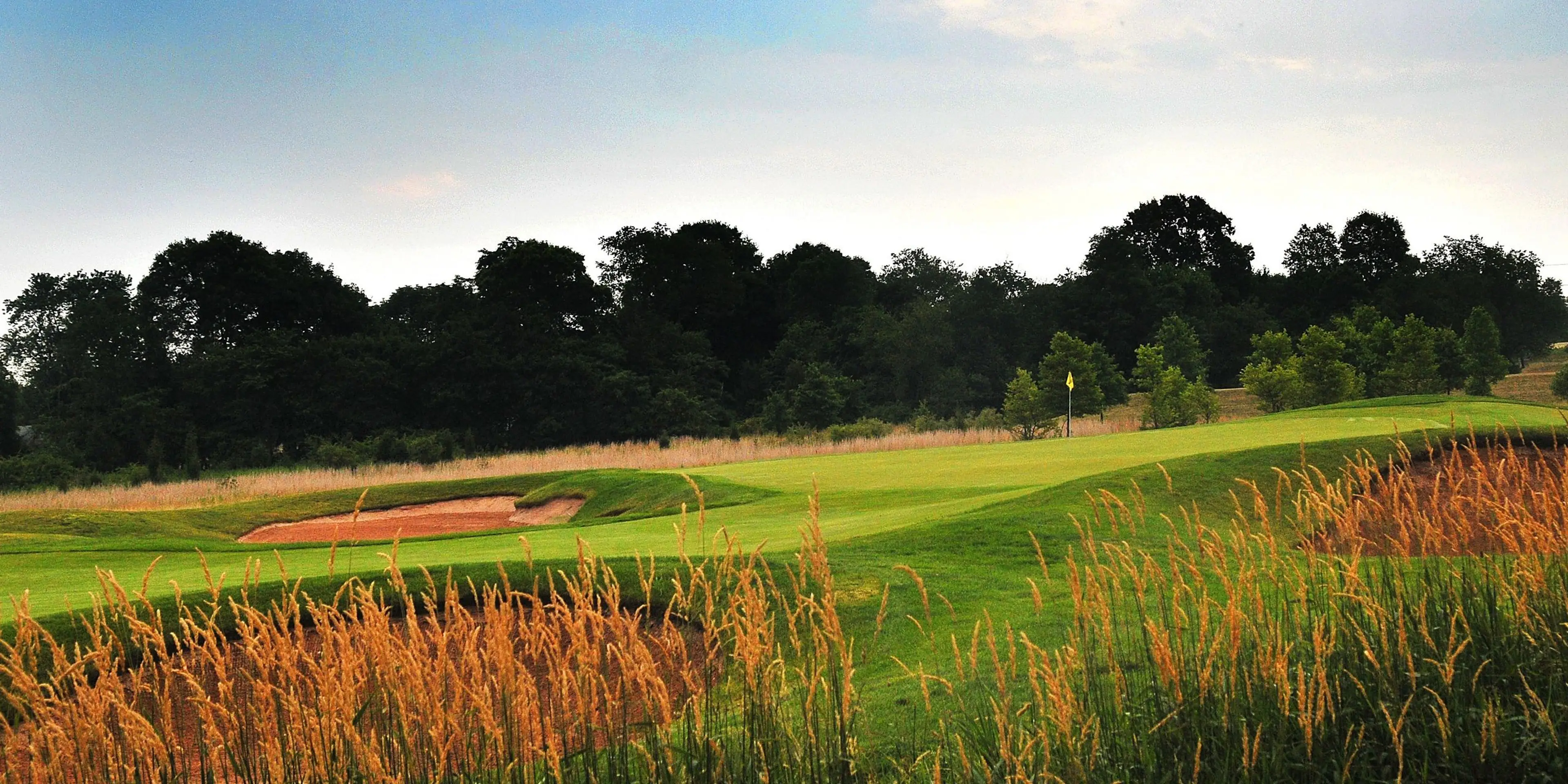 Landscape putting greens and fairway photo of the Royce Brook Golf Club golf course