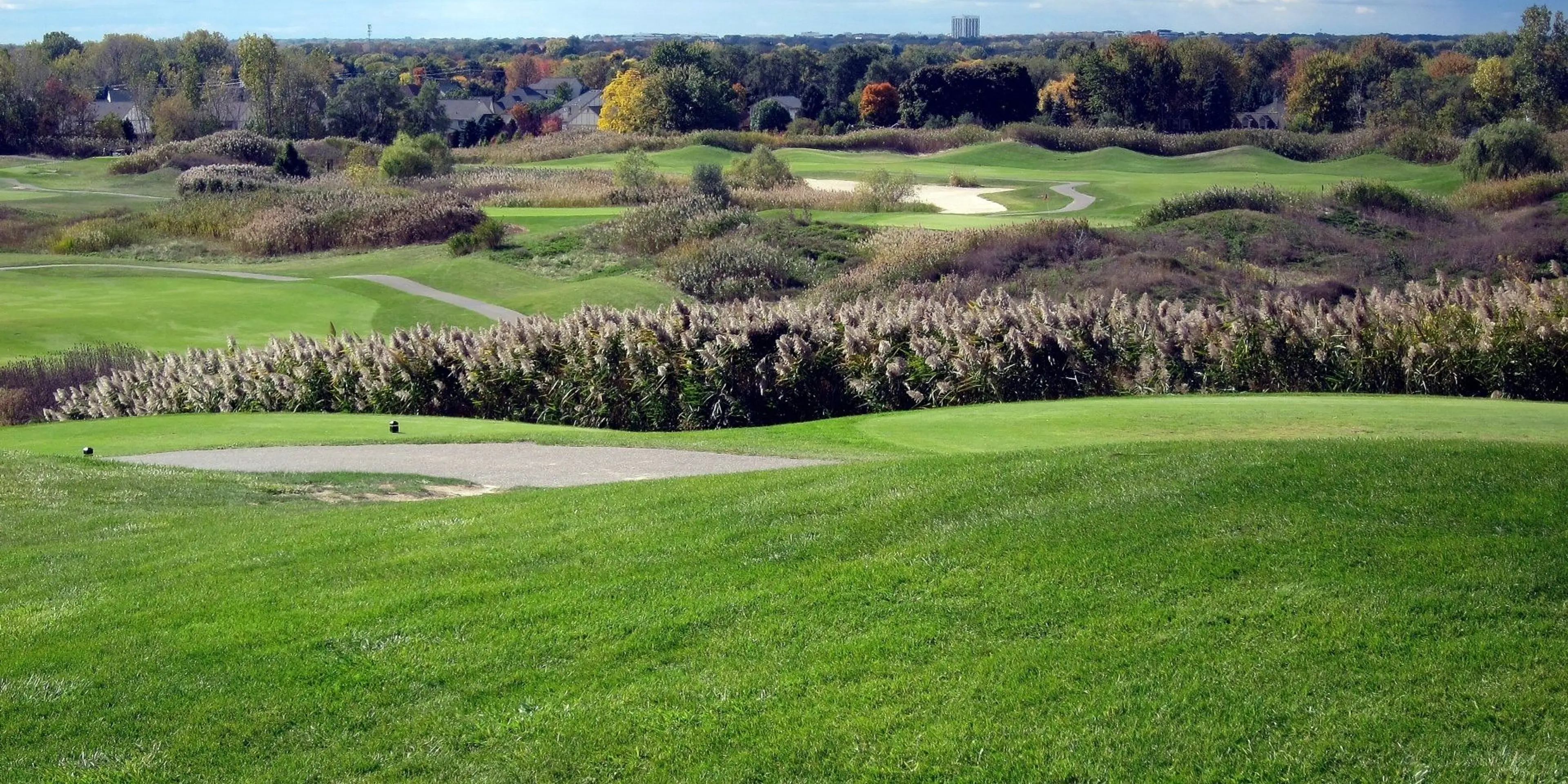 Landscape putting greens and fairway photo of the Sanctuary Lake Golf Course golf course