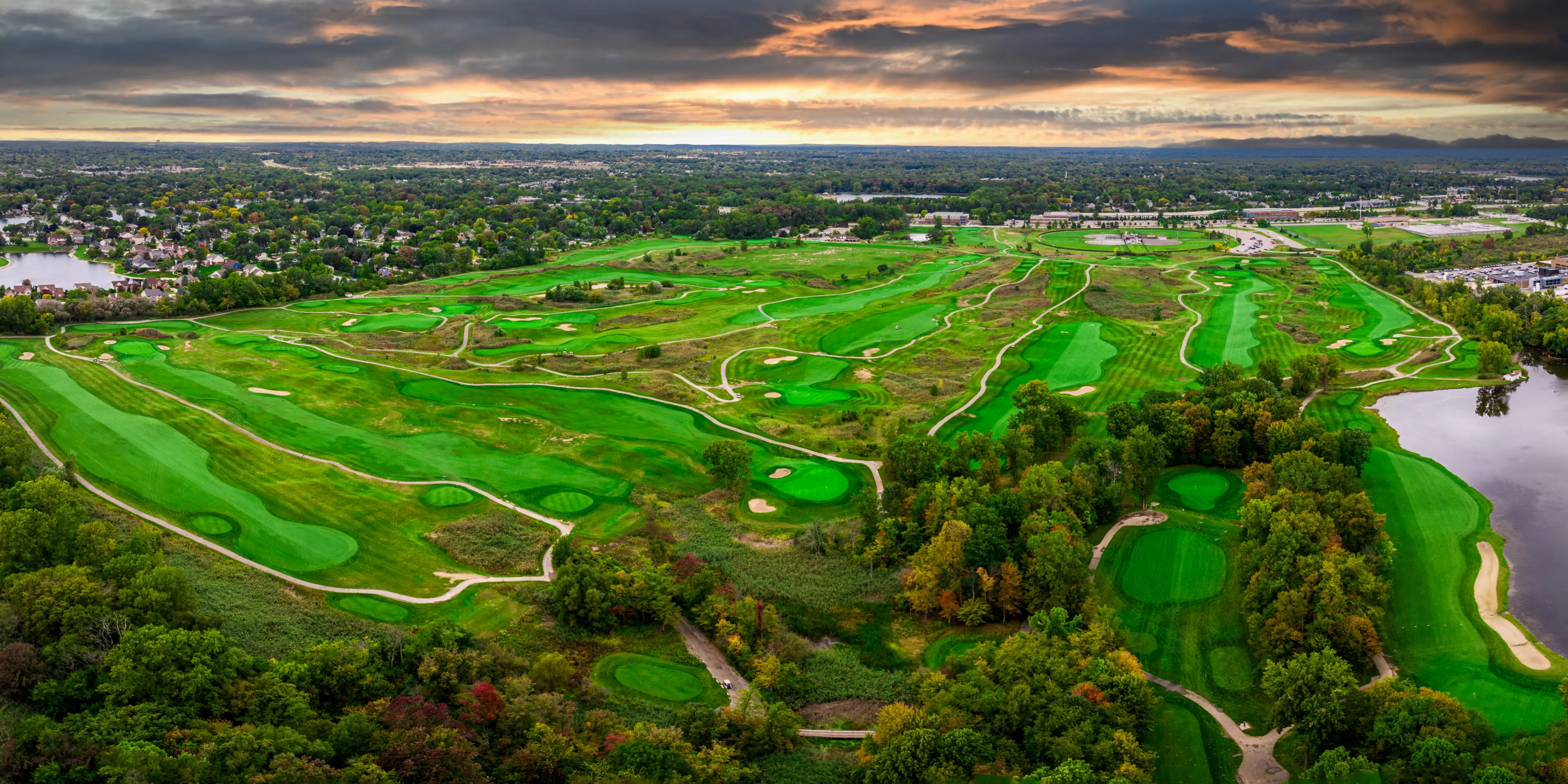 Landscape putting greens and fairway photo of the Sanctuary Lake Golf Course golf course