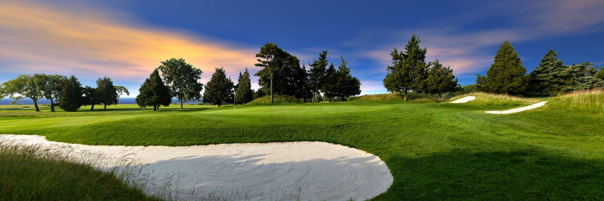 Landscape putting greens and fairway photo of the Seaview Hotel and Golf Club golf course