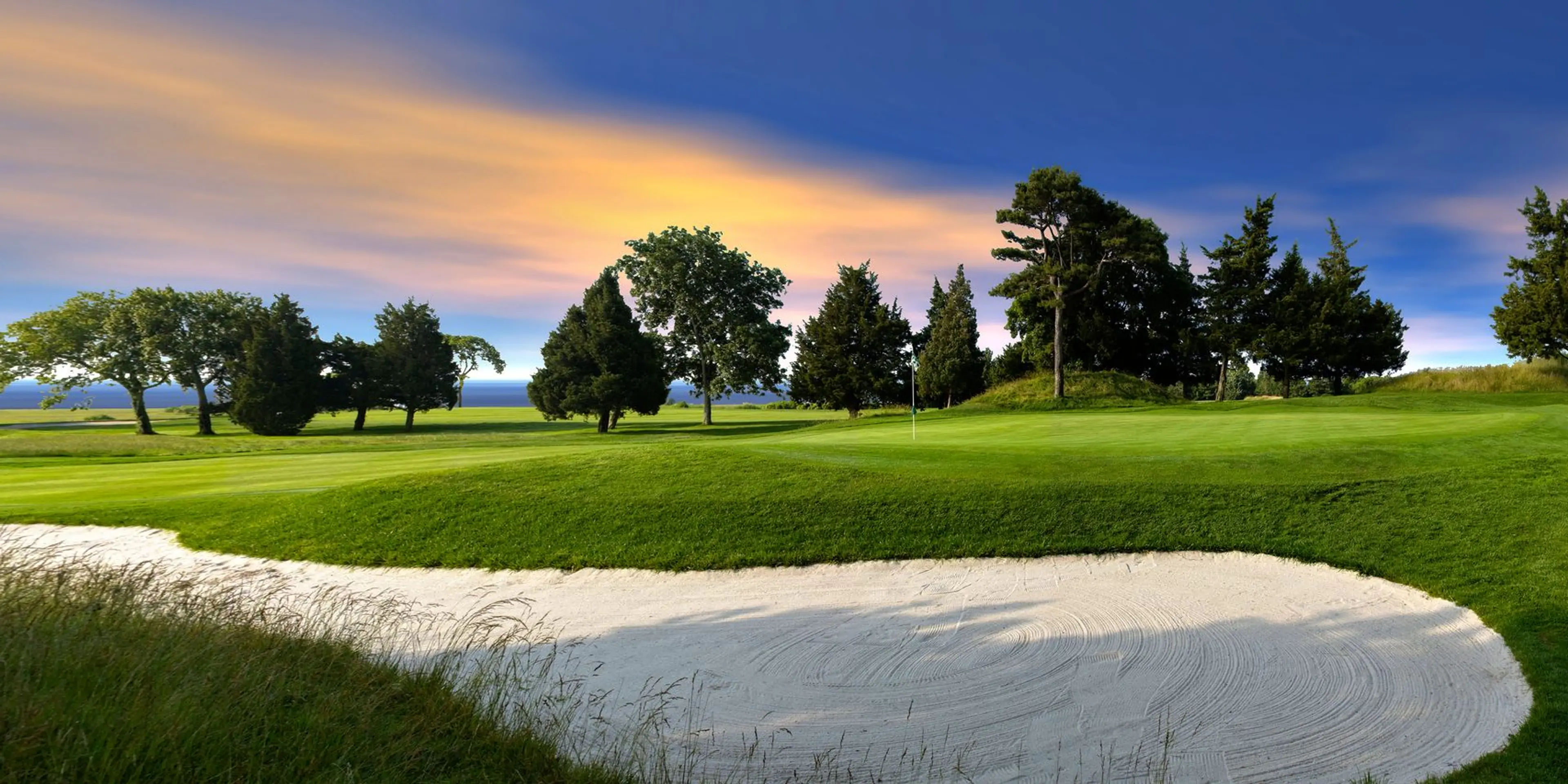 Landscape putting greens and fairway photo of the Seaview Hotel and Golf Club golf course