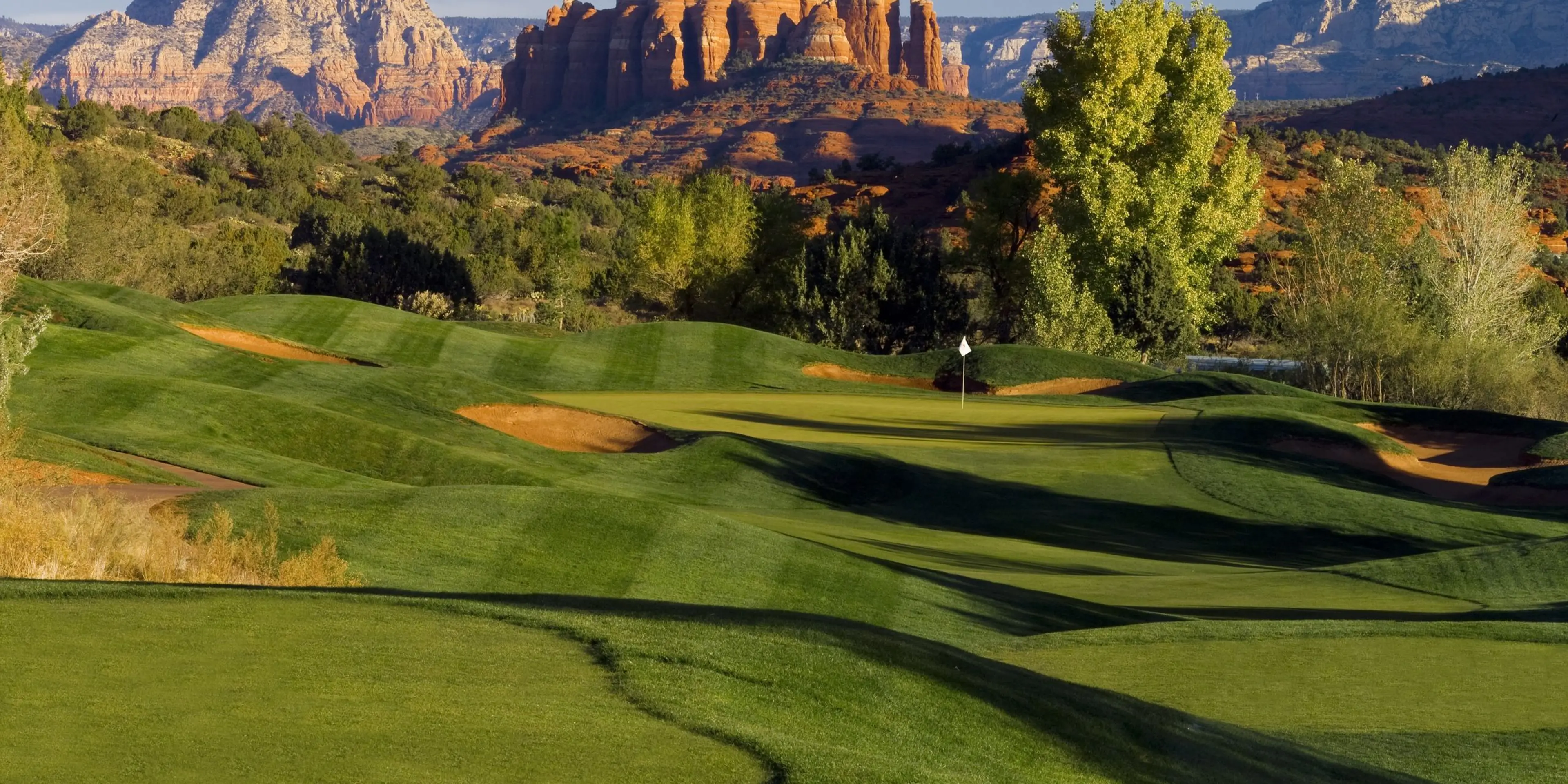 Landscape putting greens and fairway photo of the Sedona Golf Resort golf course