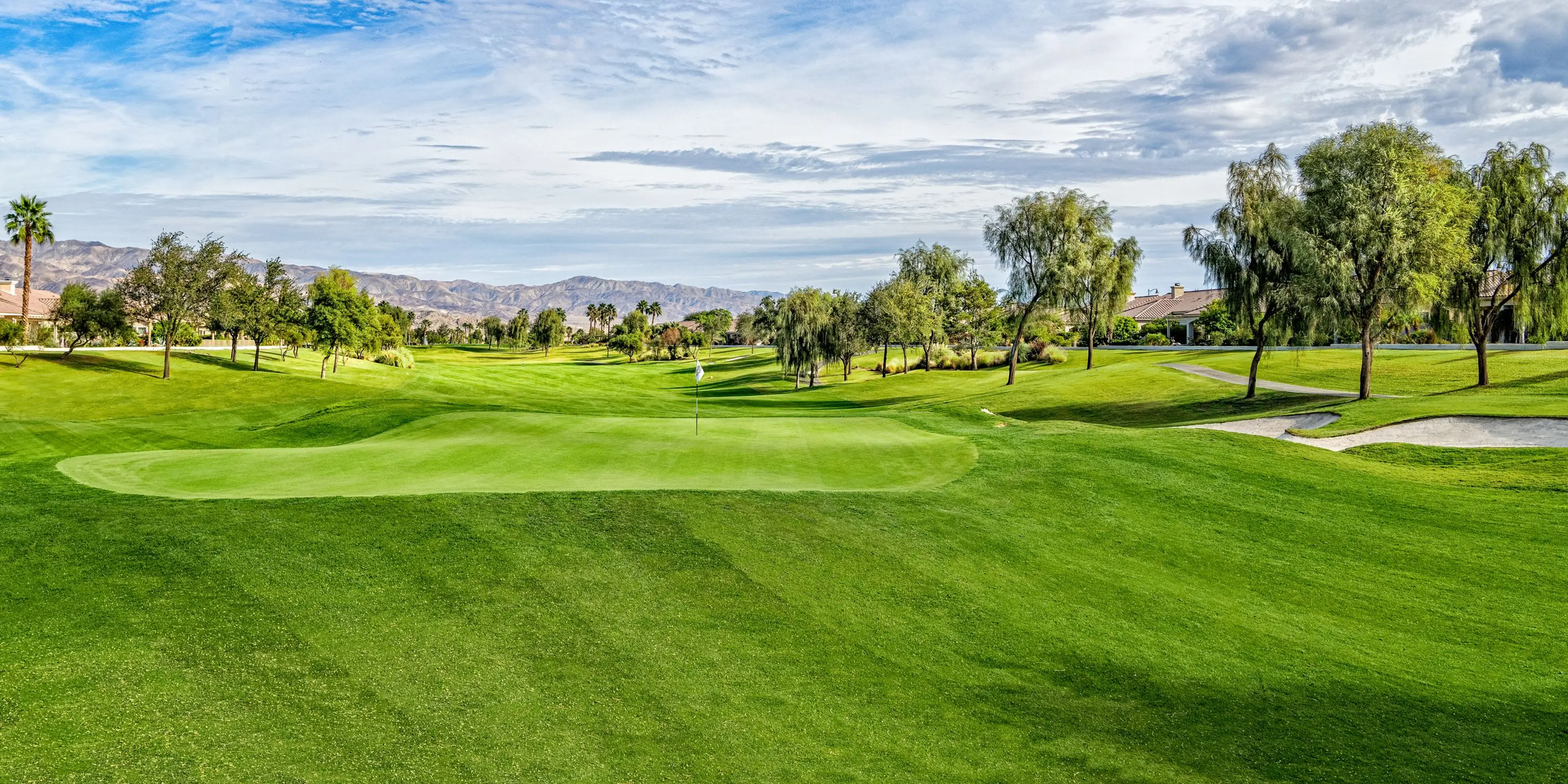 Landscape putting greens and fairway photo of the Shadow Hills Golf Club golf course