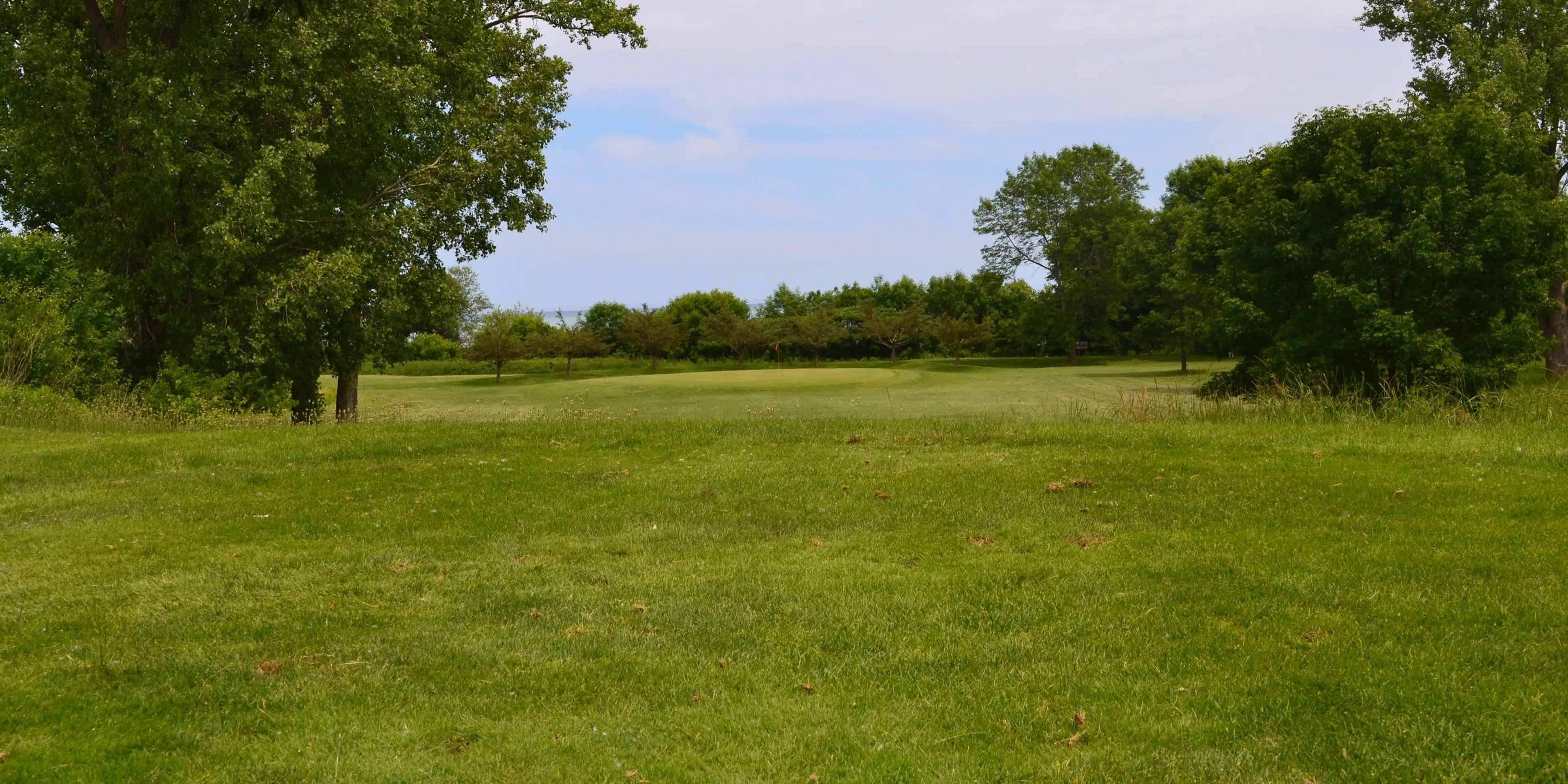Landscape putting greens and fairway photo of the Shoop Park Golf Course golf course