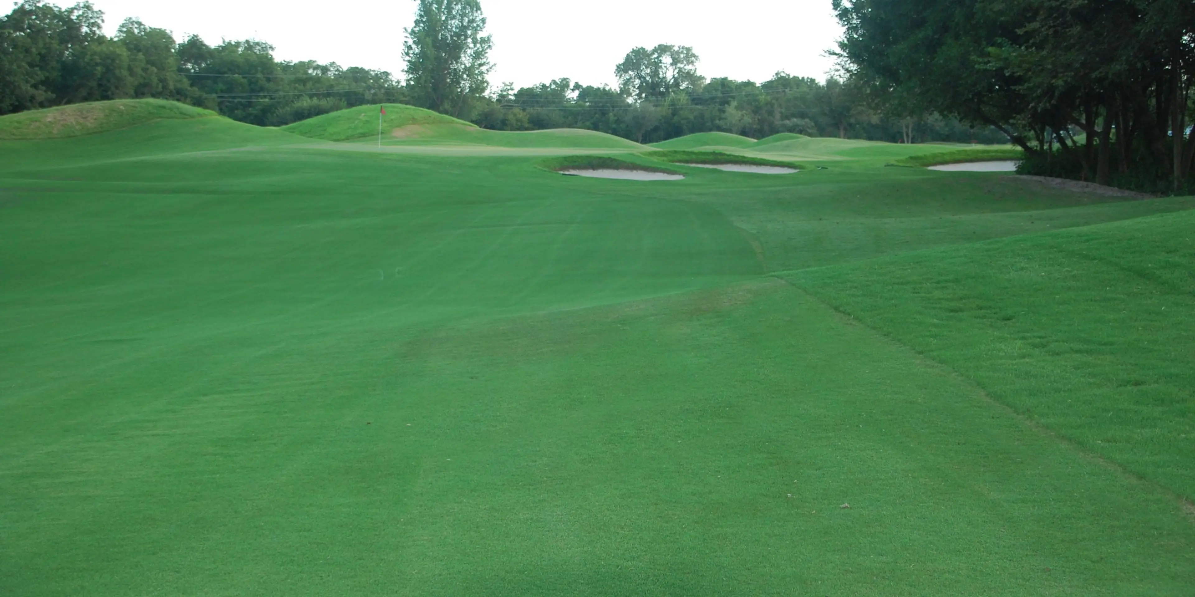 Landscape putting greens and fairway photo of the Split Rail Golf Club golf course