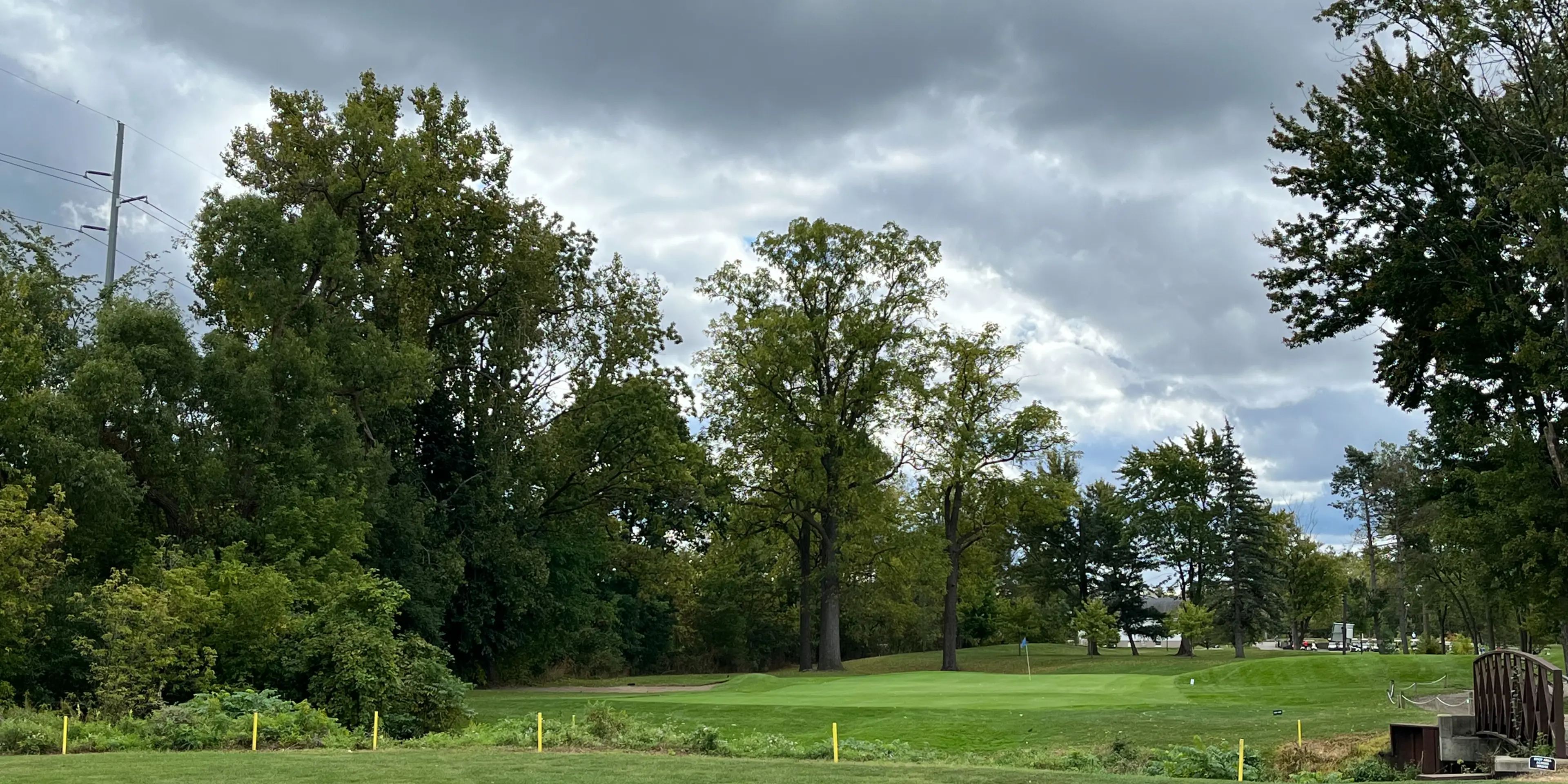 Landscape putting greens and fairway photo of the Sylvan Glen Golf Course golf course