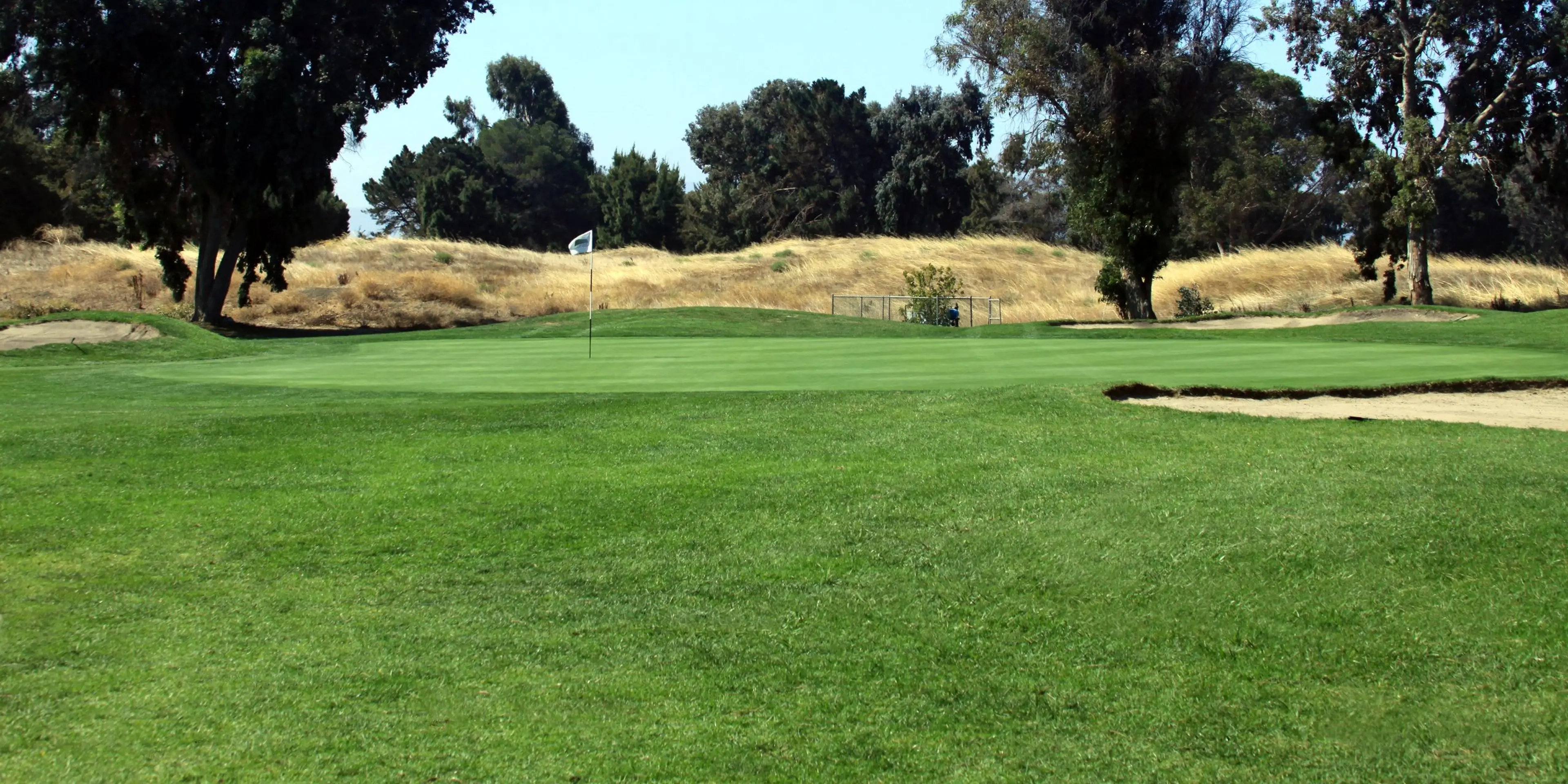 Landscape putting greens and fairway photo of the The Golf Club at Moffett Field golf course