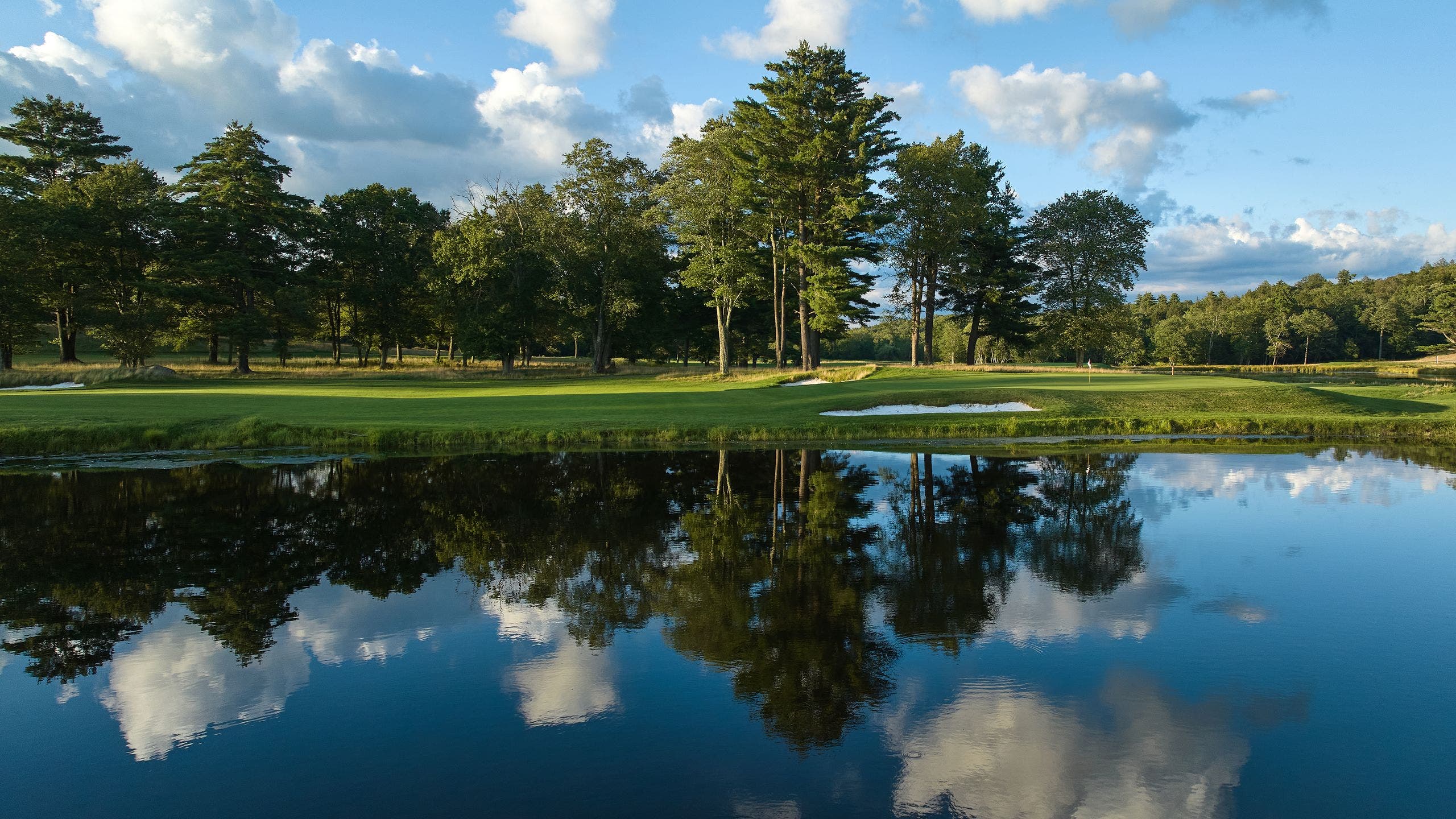 Landscape putting greens and fairway photo of the The Monster Golf Club golf course