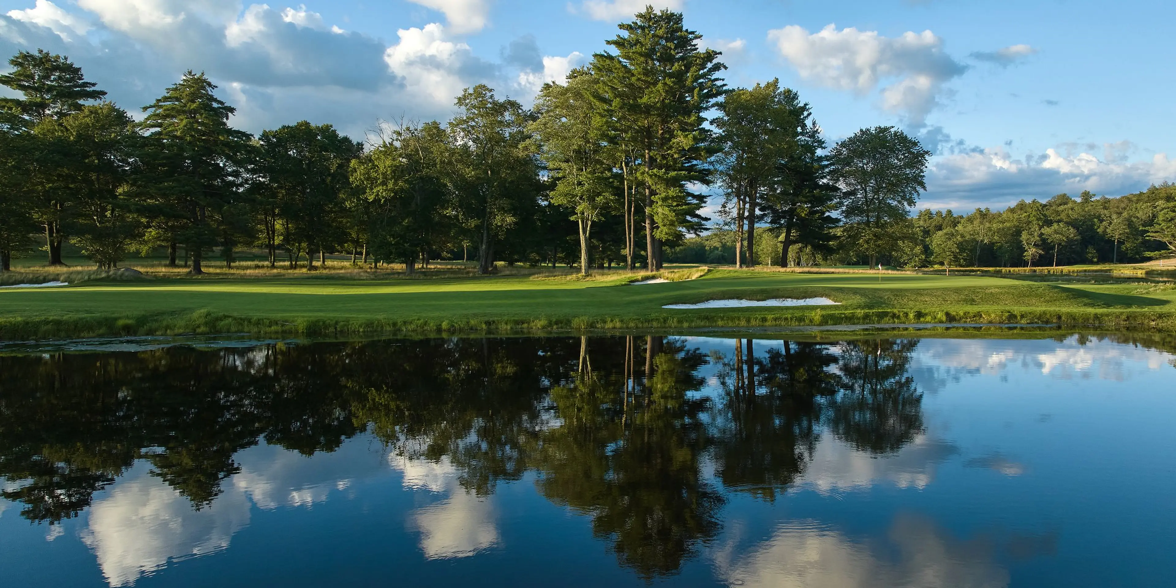 Landscape putting greens and fairway photo of the The Monster Golf Club golf course