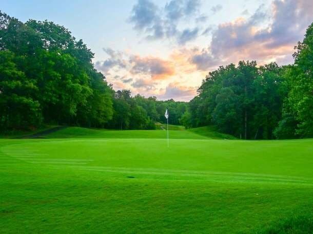 Landscape putting greens and fairway photo of the The Preserve at Eisenhower Golf Course golf course