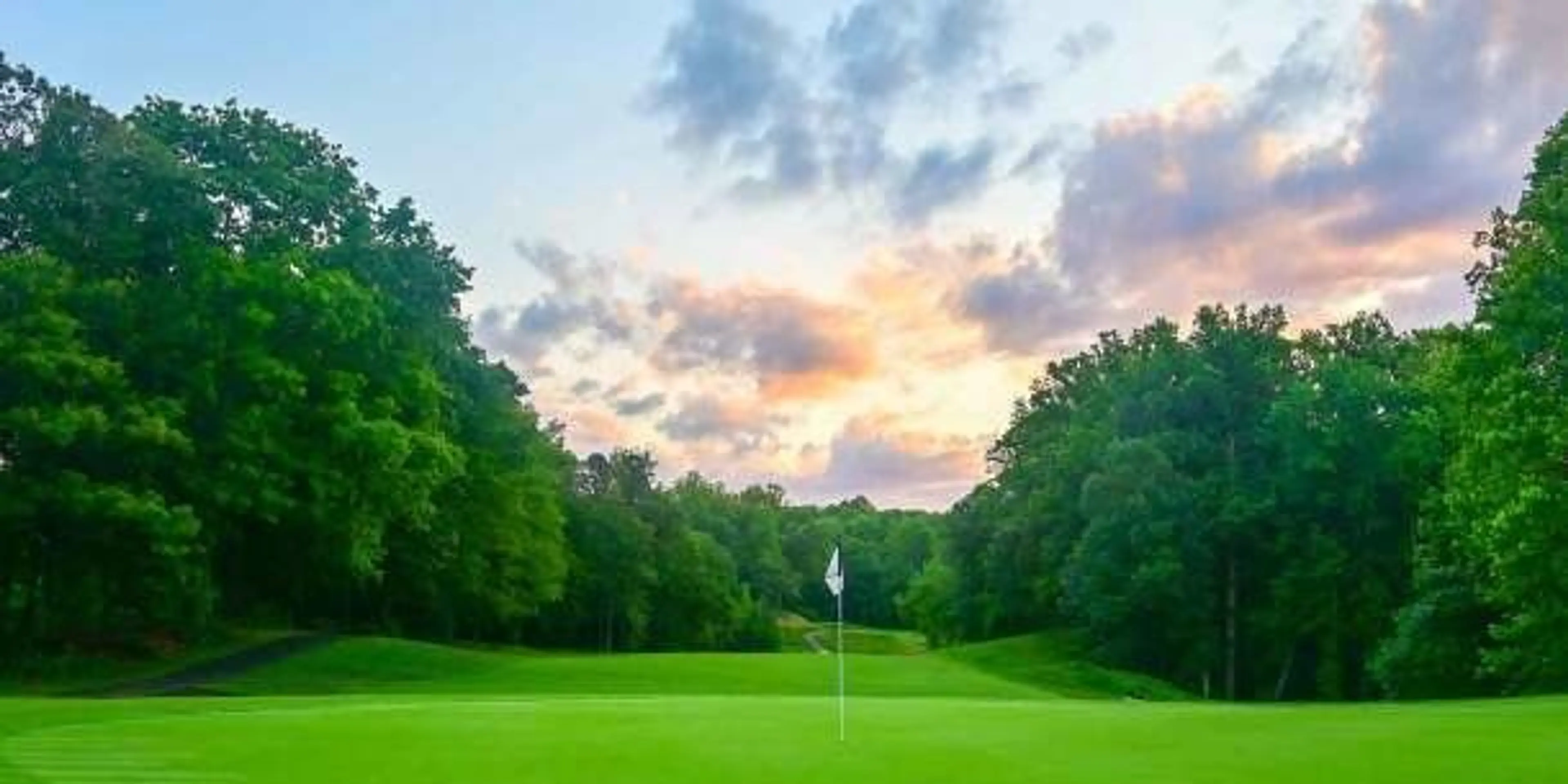 Landscape putting greens and fairway photo of the The Preserve at Eisenhower Golf Course golf course