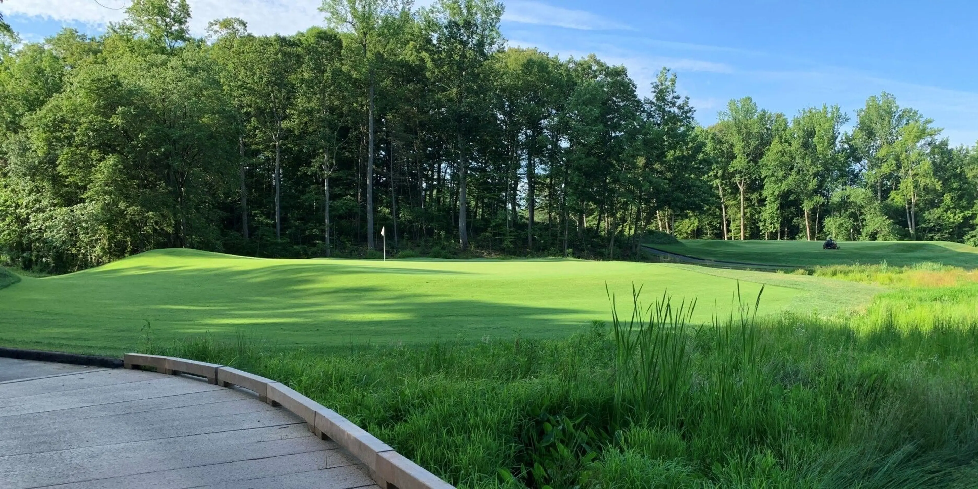 Landscape putting greens and fairway photo of the The Preserve at Eisenhower Golf Course golf course