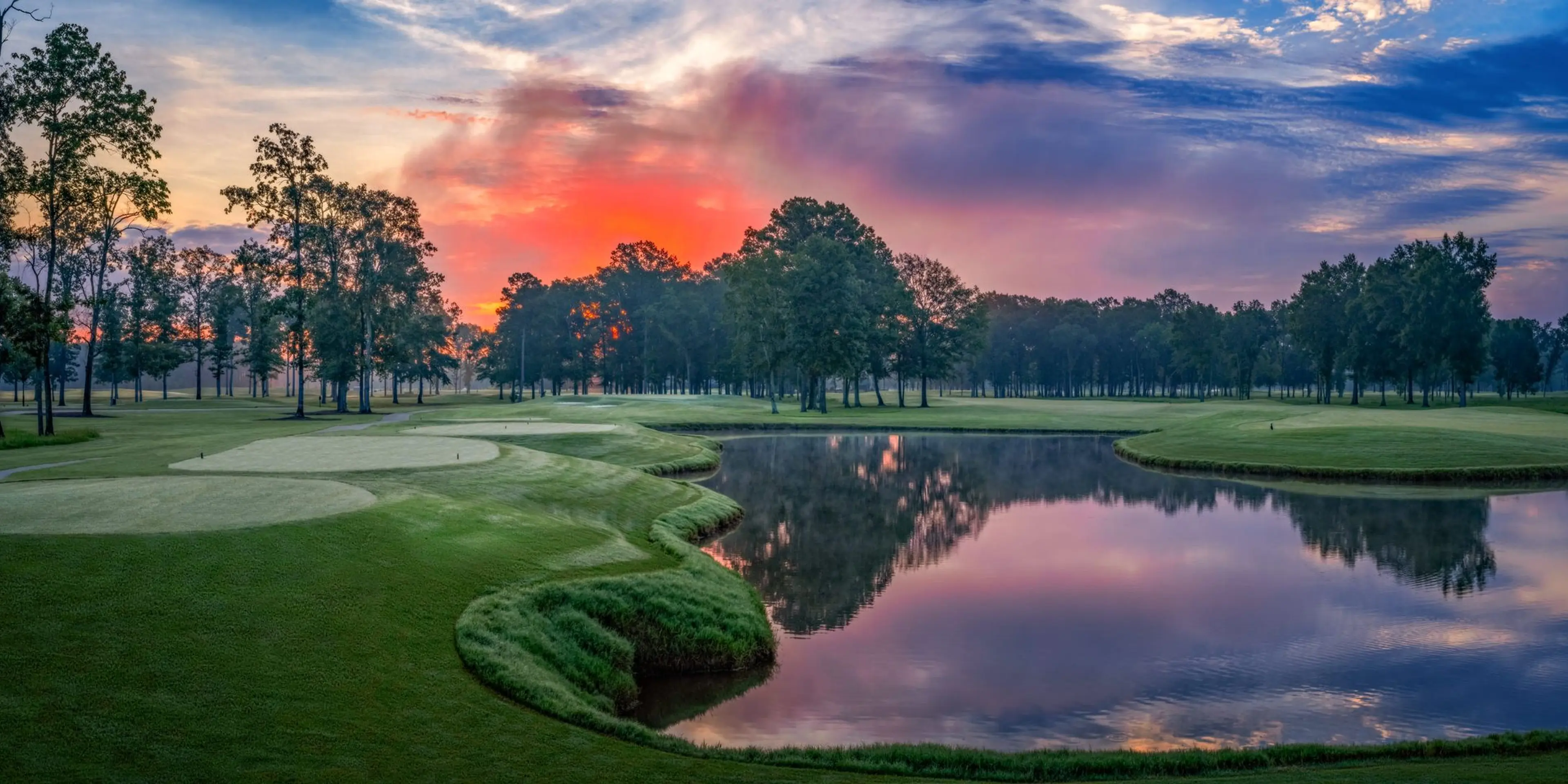 Landscape putting greens and fairway photo of the The Refuge Golf Course golf course