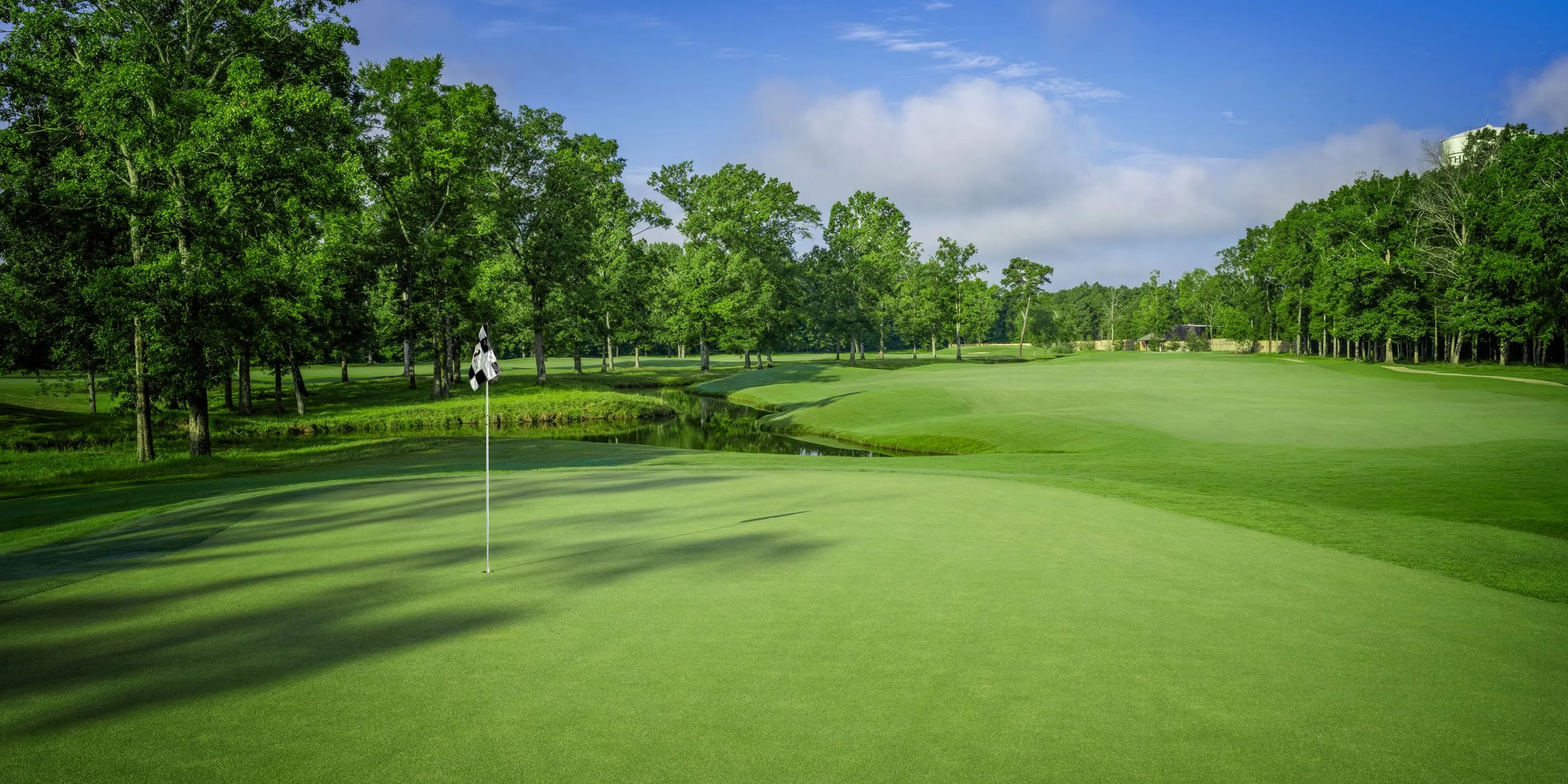 Landscape putting greens and fairway photo of the The Refuge Golf Course golf course