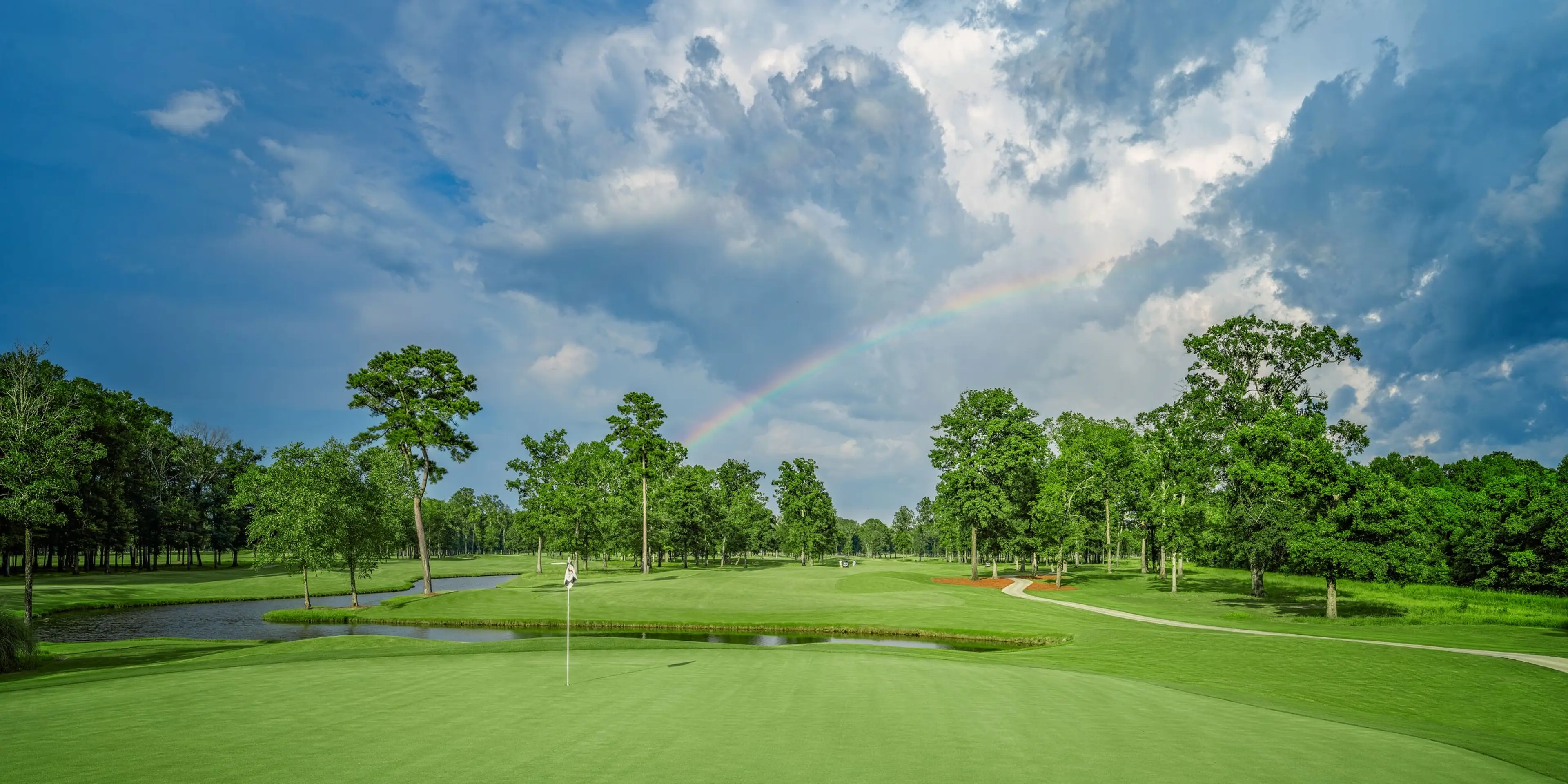 Landscape putting greens and fairway photo of the The Refuge Golf Course golf course