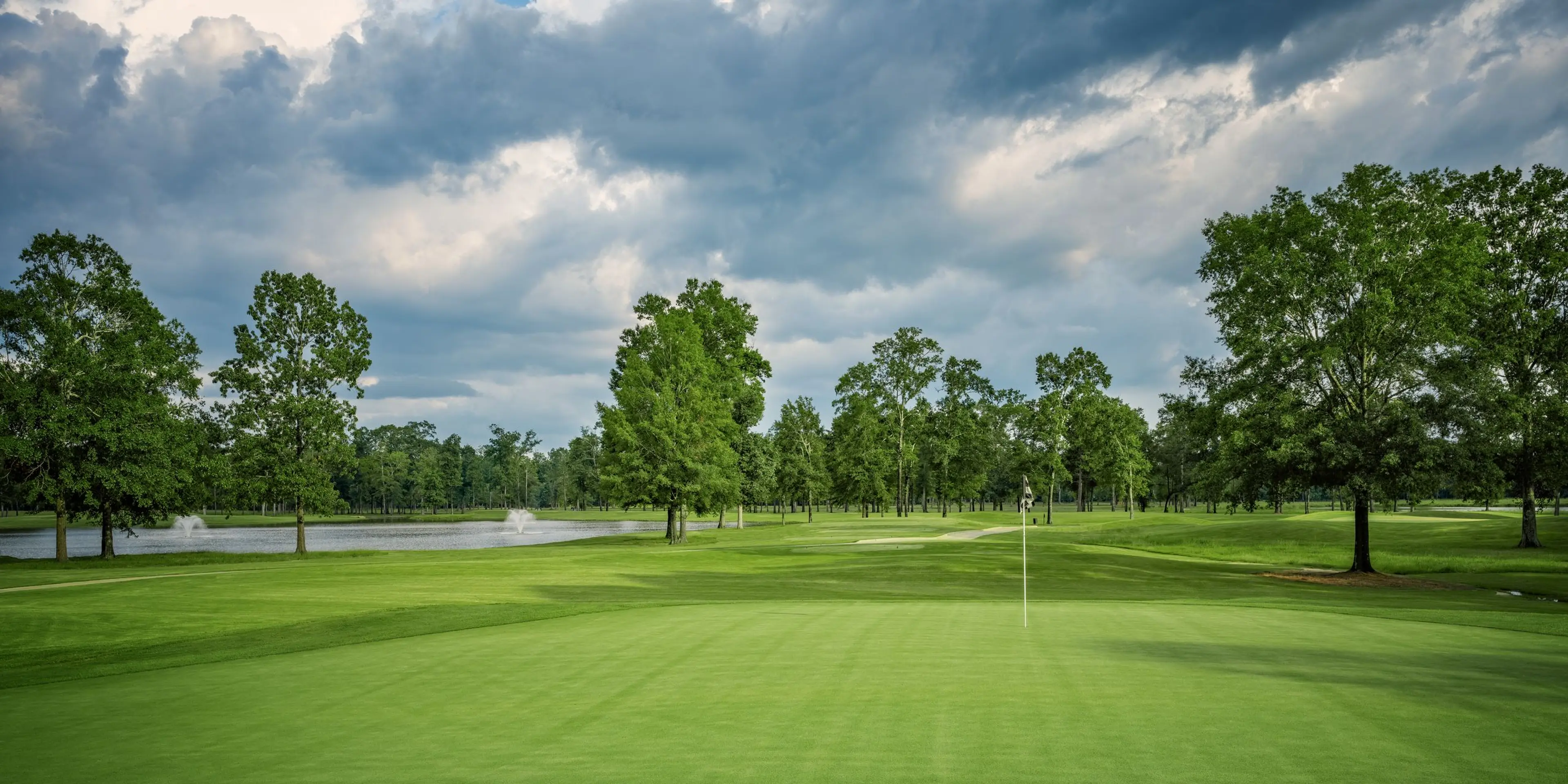 Landscape putting greens and fairway photo of the The Refuge Golf Course golf course