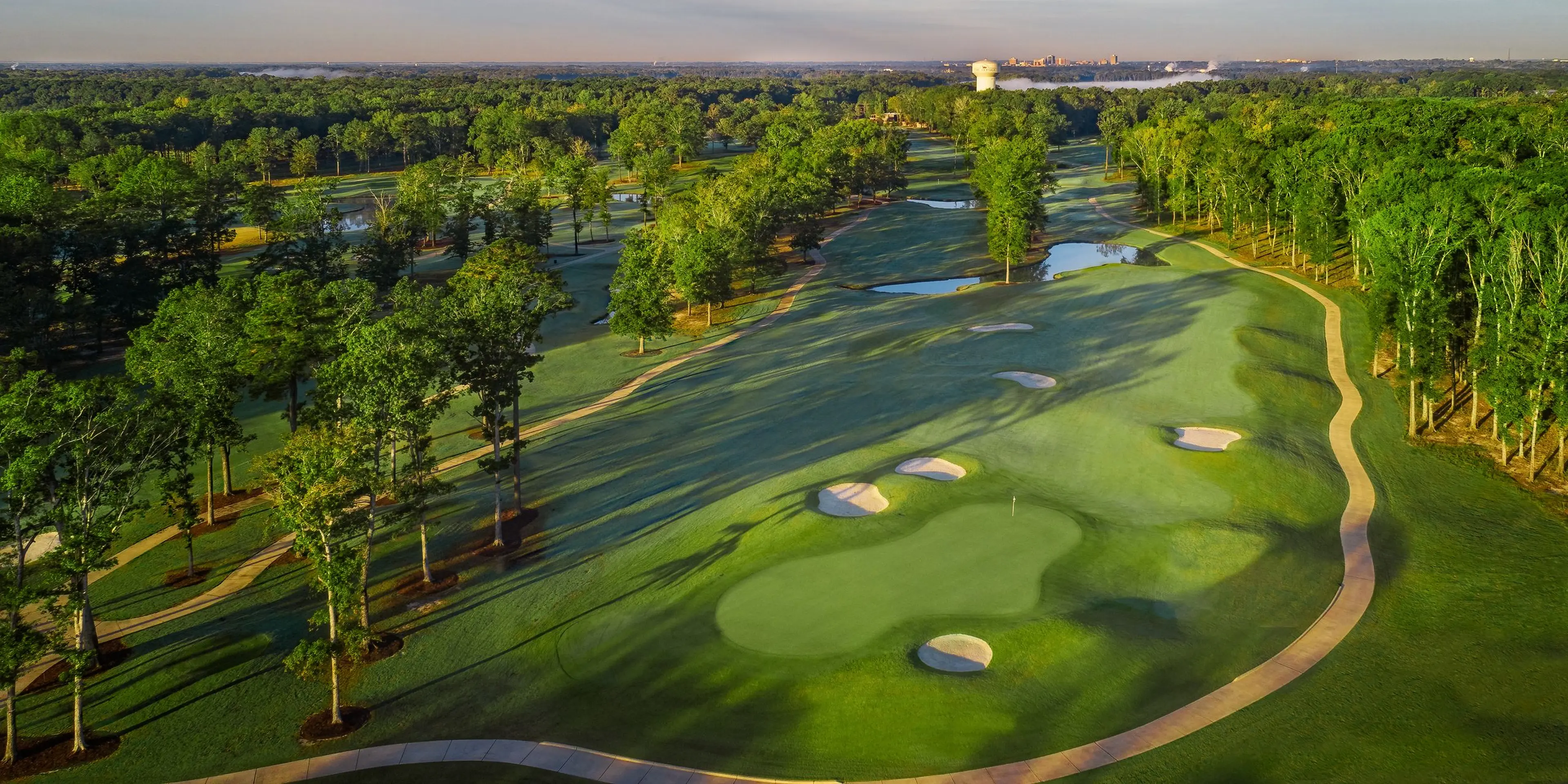 Landscape putting greens and fairway photo of the The Refuge Golf Course golf course