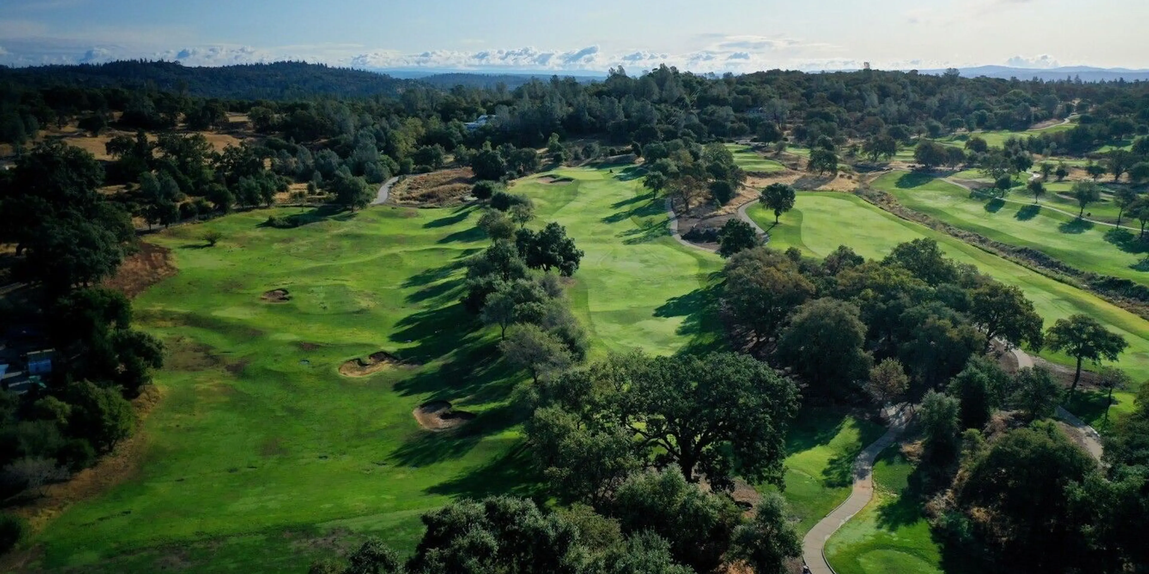 Landscape putting greens and fairway photo of the The Ridge Golf and Event Center golf course