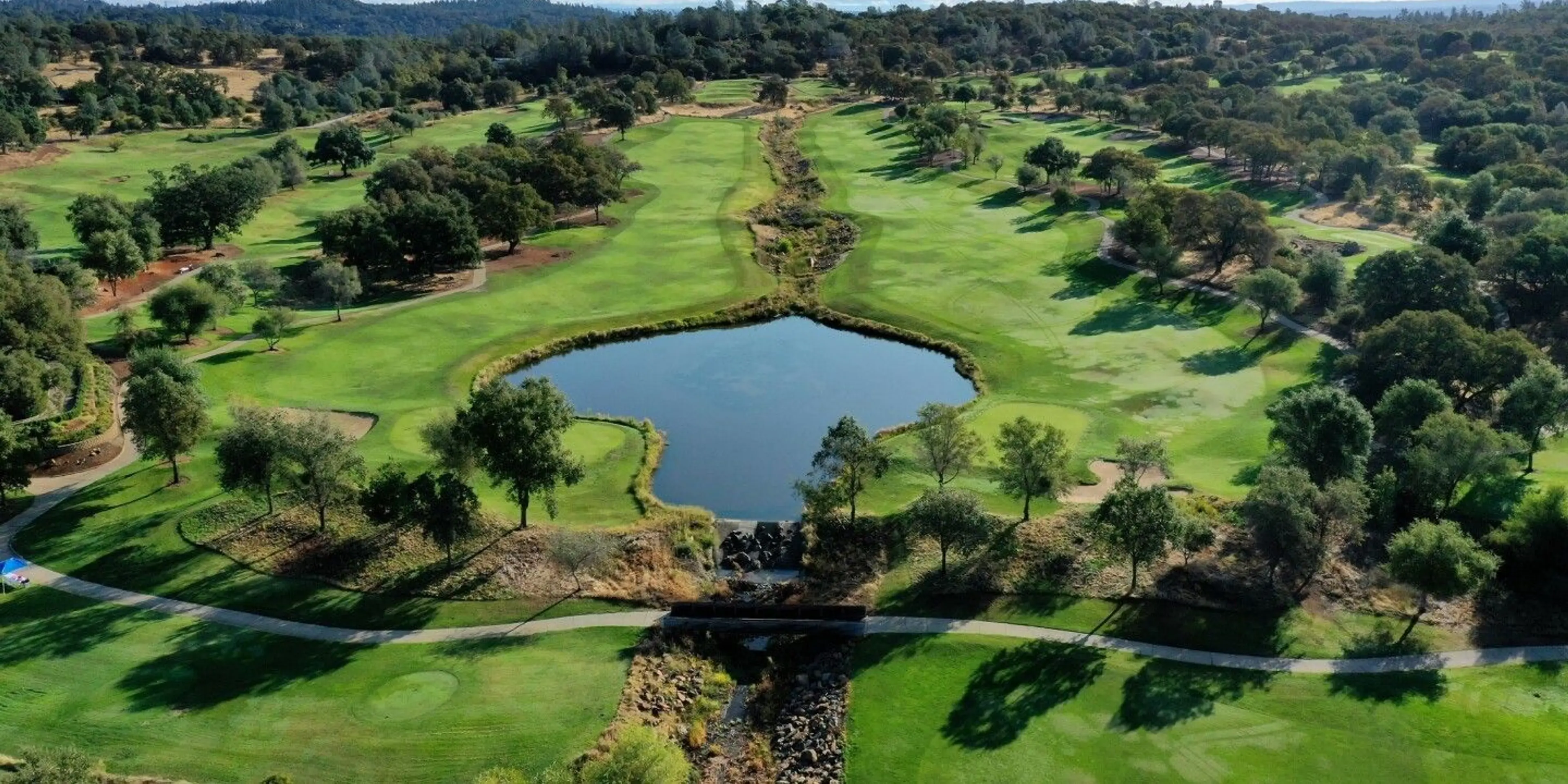 Landscape putting greens and fairway photo of the The Ridge Golf and Event Center golf course