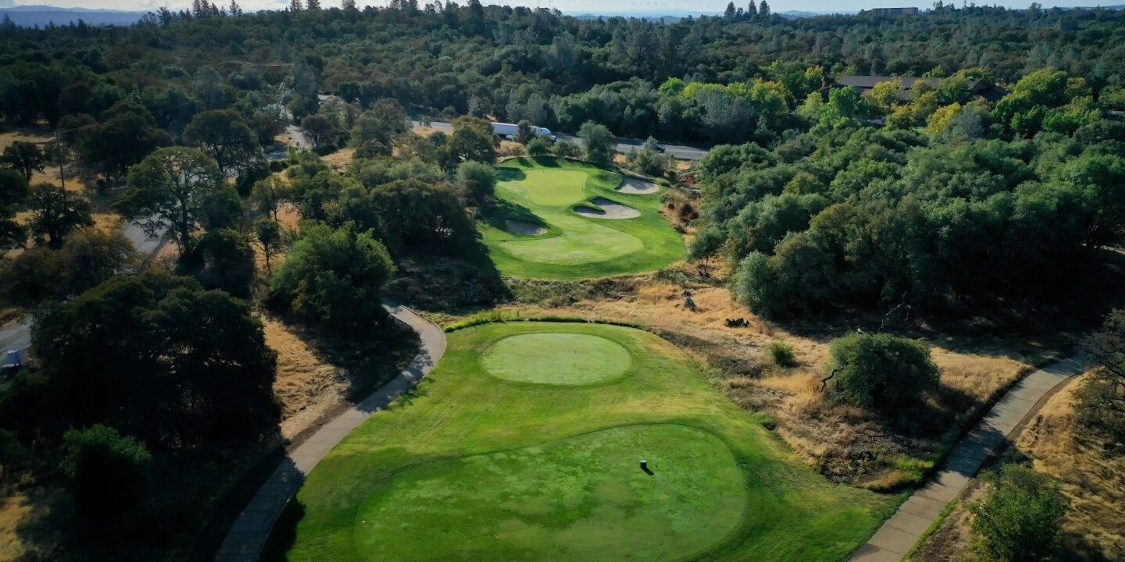 Landscape putting greens and fairway photo of the The Ridge Golf and Event Center golf course
