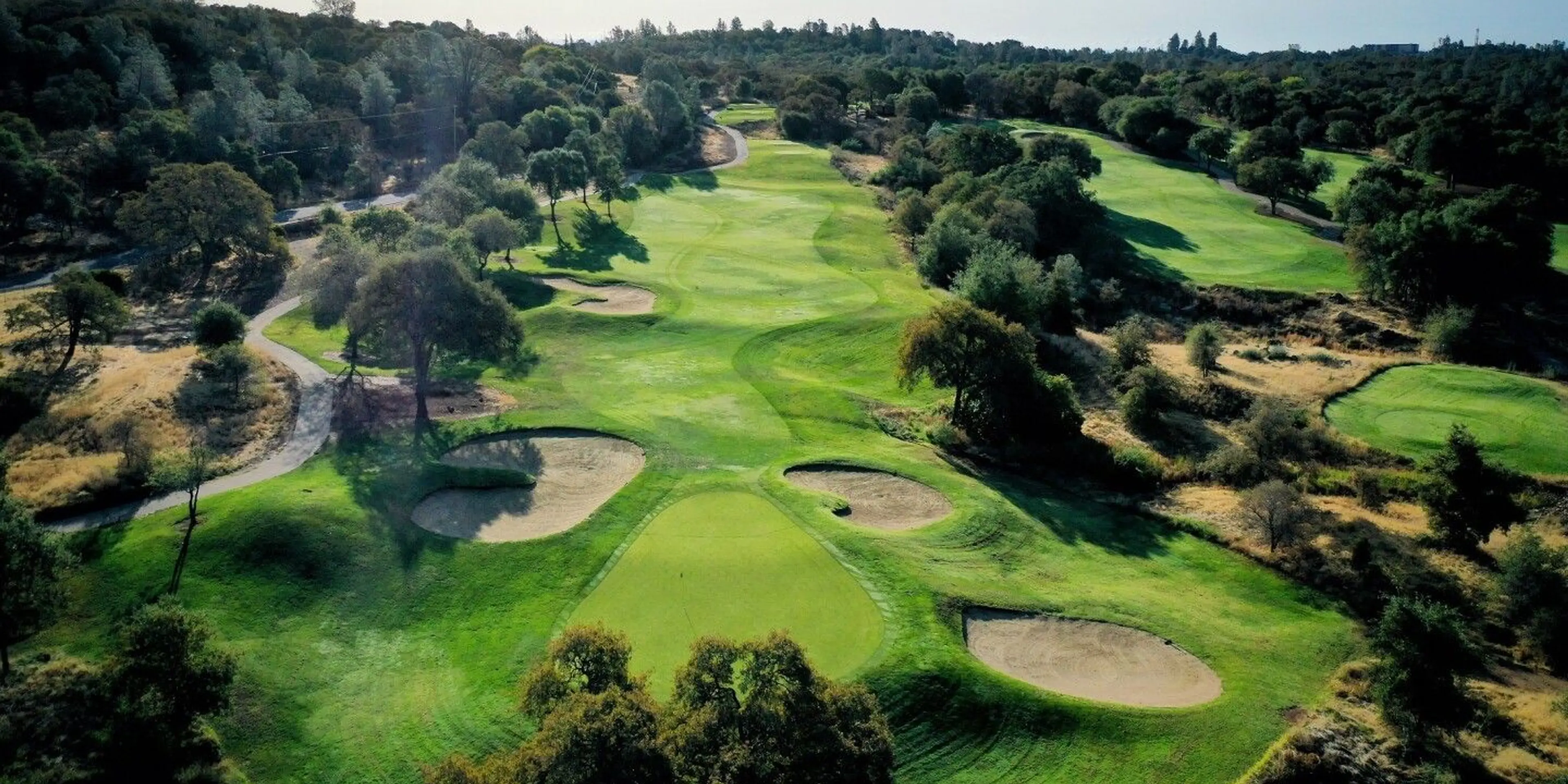 Landscape putting greens and fairway photo of the The Ridge Golf and Event Center golf course