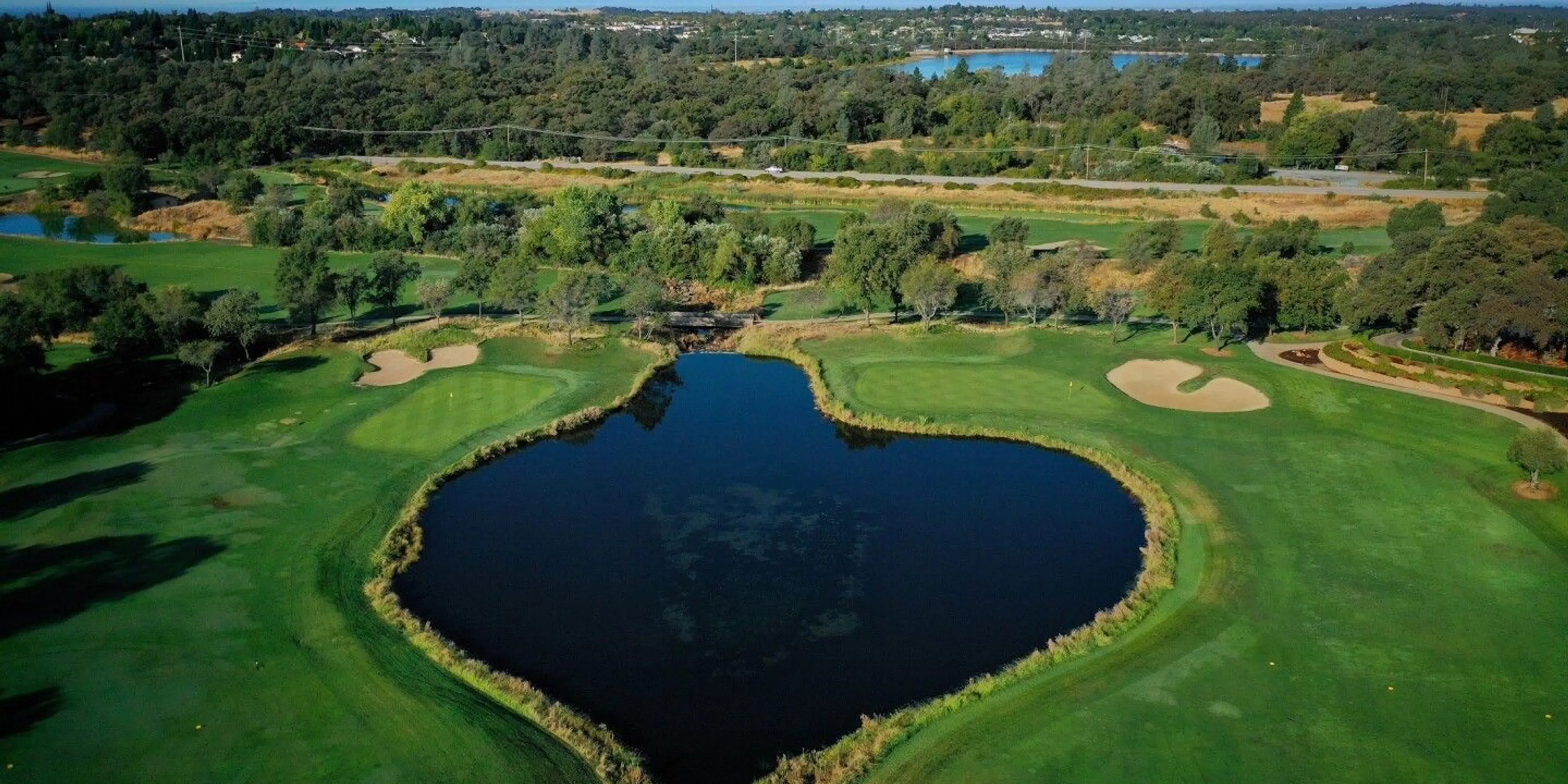 Landscape putting greens and fairway photo of the The Ridge Golf and Event Center golf course