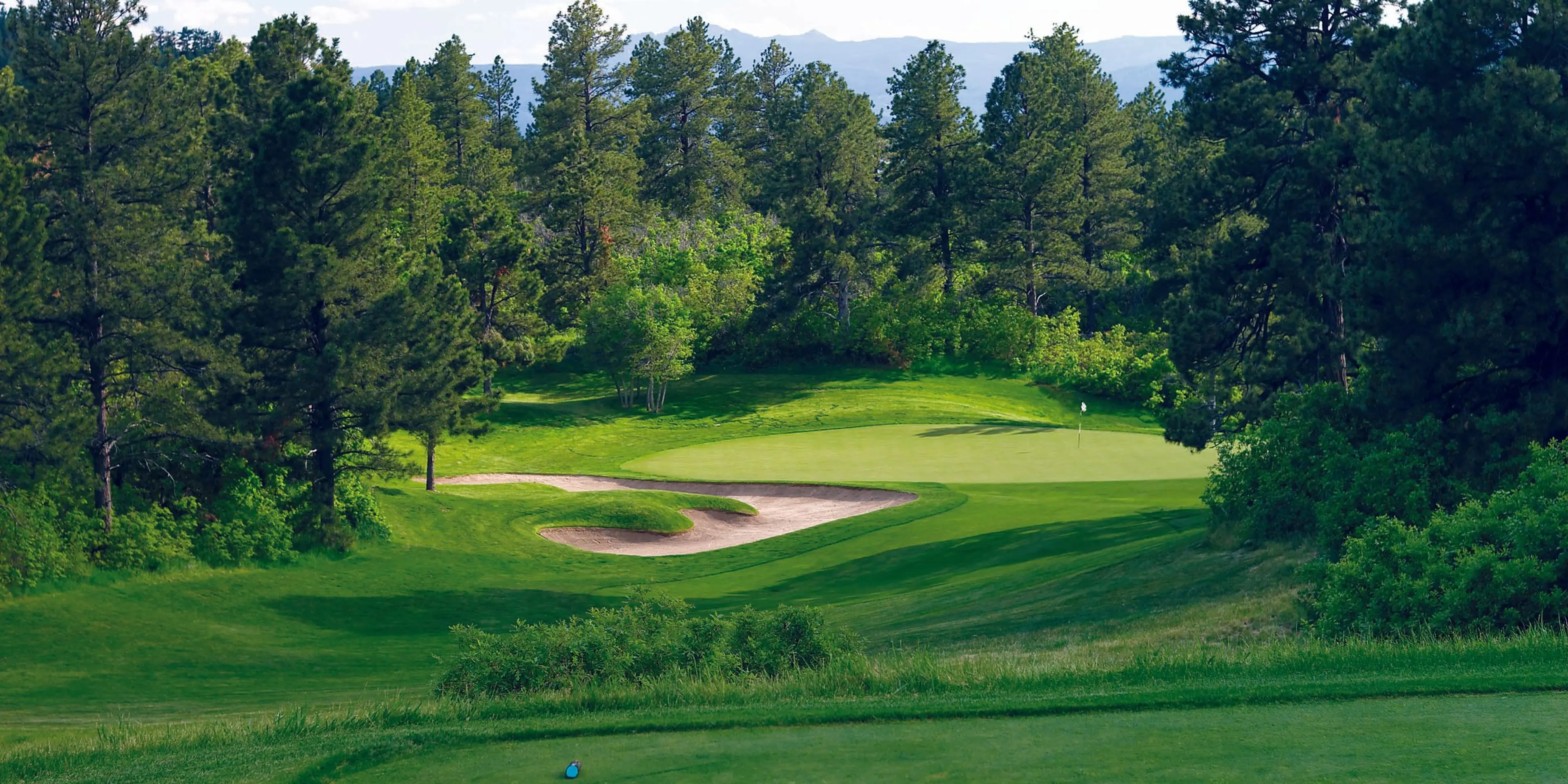 Landscape putting greens and fairway photo of the The Ridge golf course