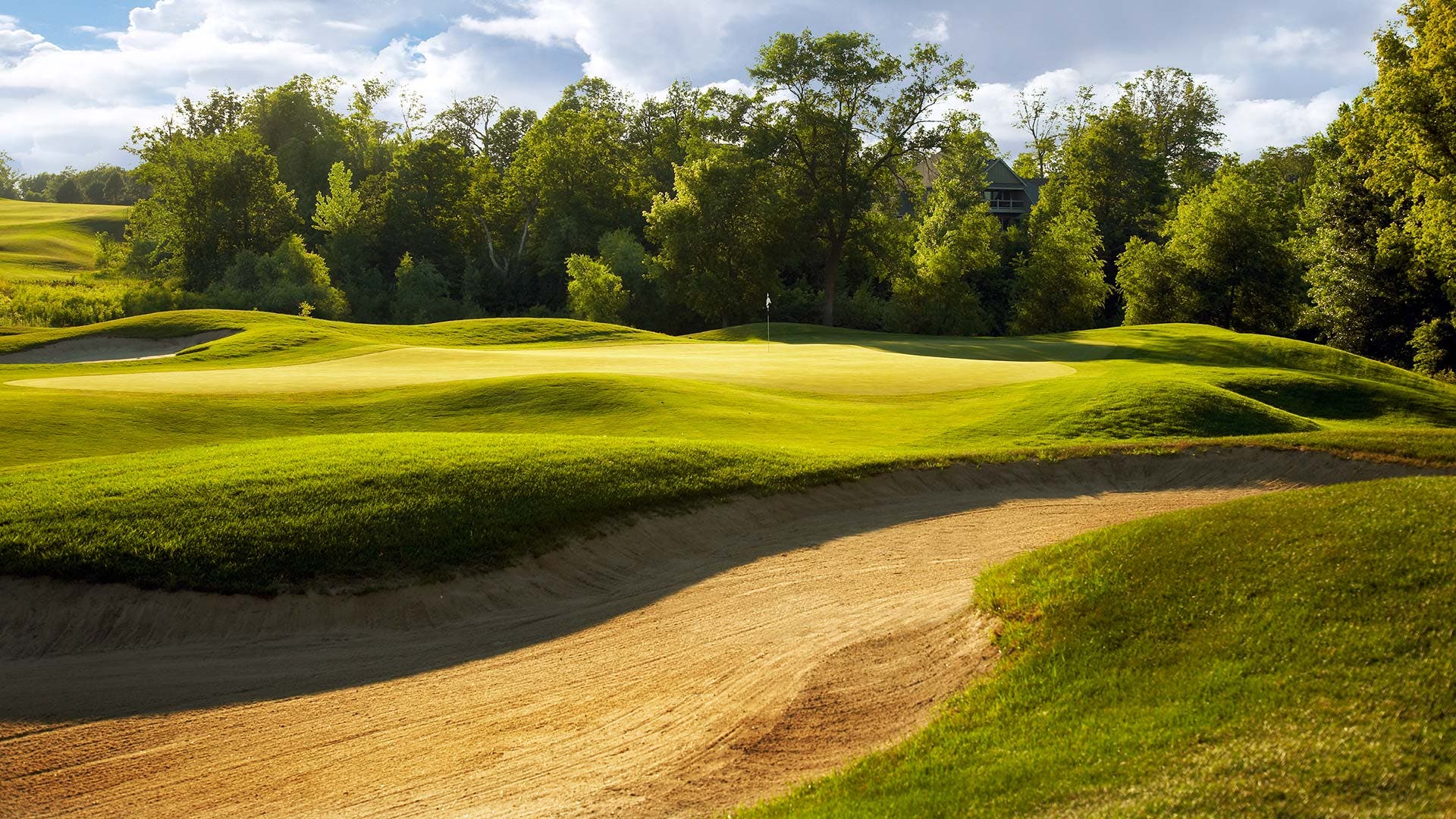 Landscape putting greens and fairway photo of the The Wilds Golf Club golf course