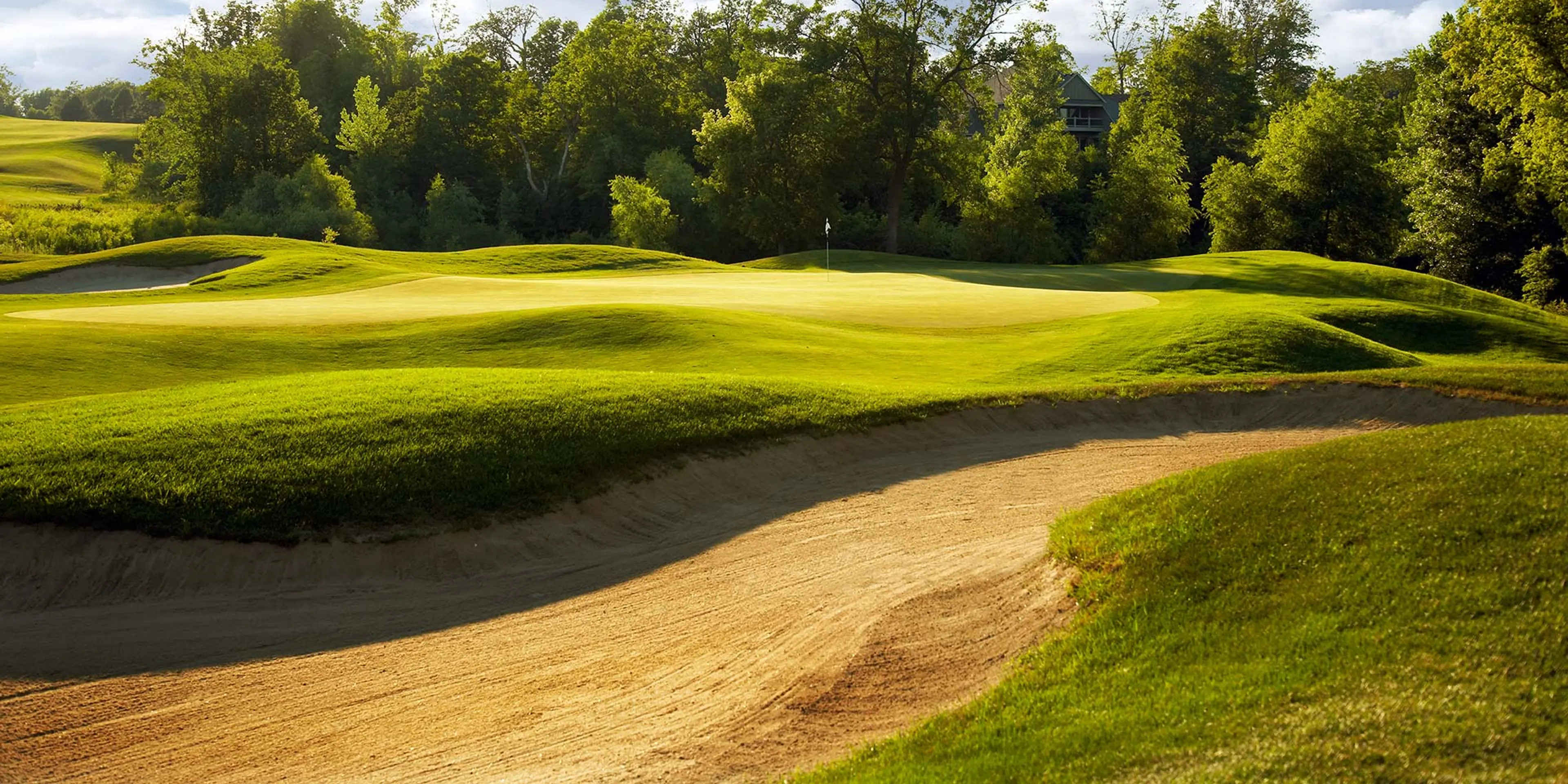 Landscape putting greens and fairway photo of the The Wilds Golf Club golf course