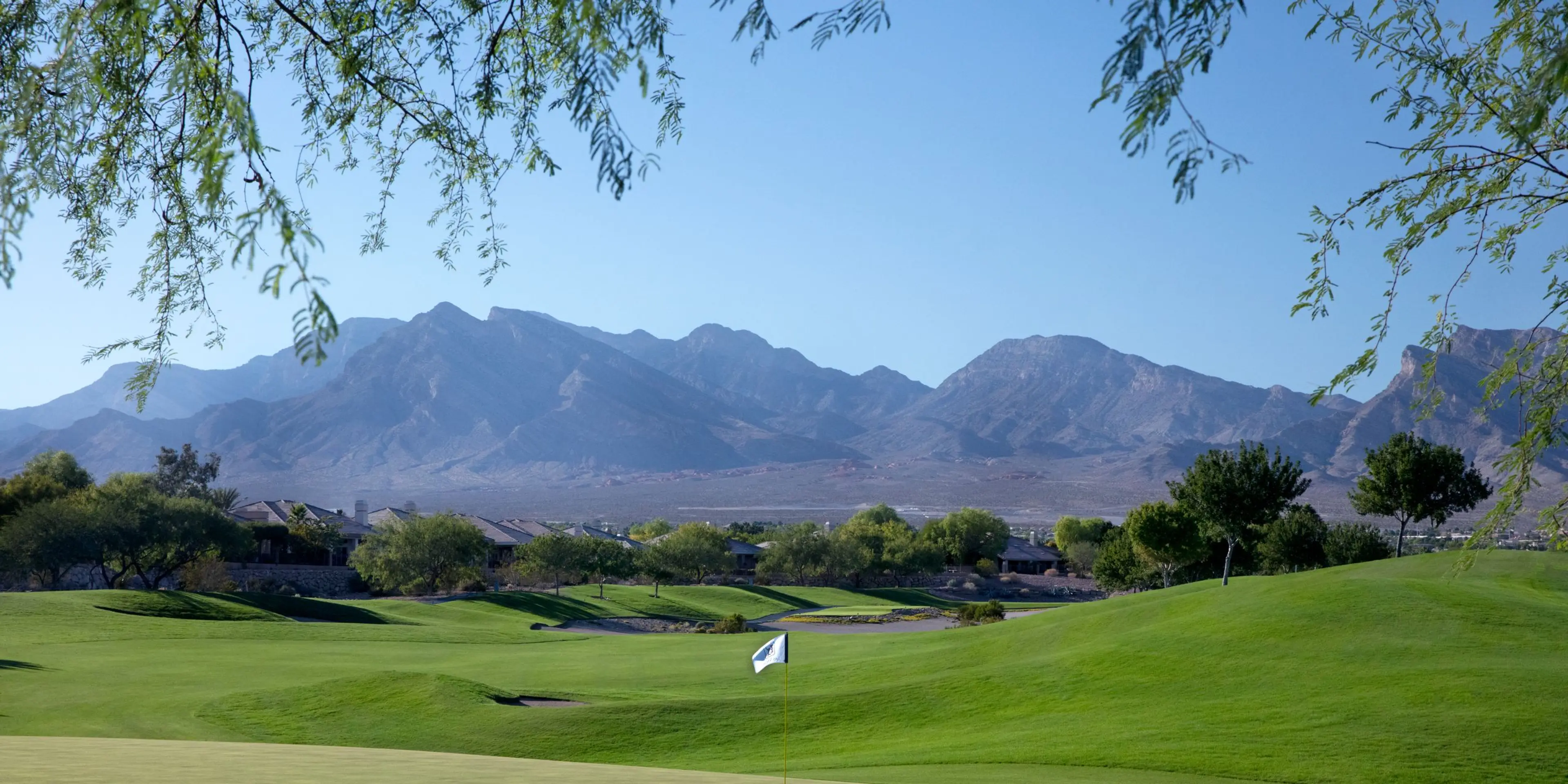 Landscape putting greens and fairway photo of the TPC Las Vegas golf course