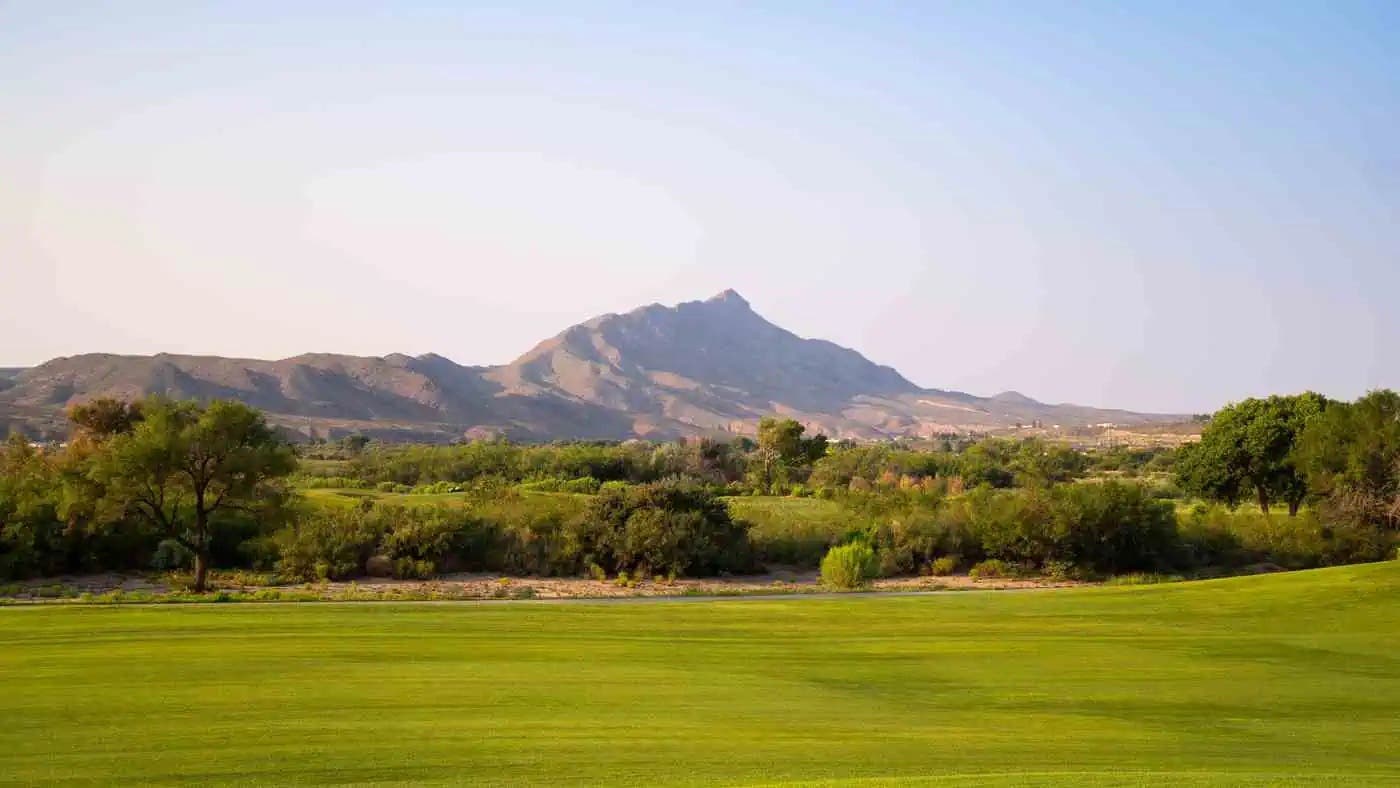 Landscape putting greens and fairway photo of the Turtleback Mountain Golf & Resort  golf course