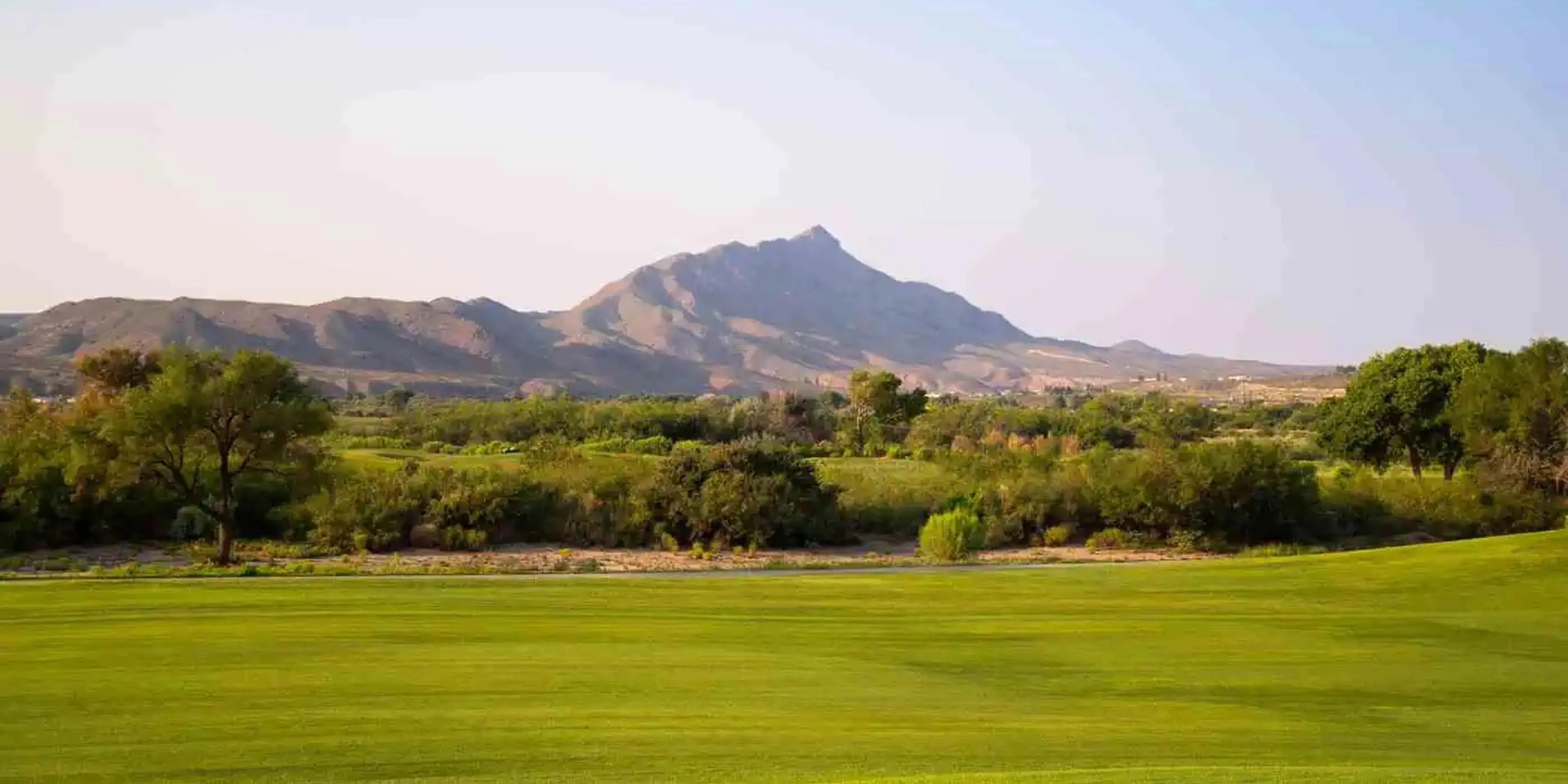 Landscape putting greens and fairway photo of the Turtleback Mountain Golf & Resort golf course